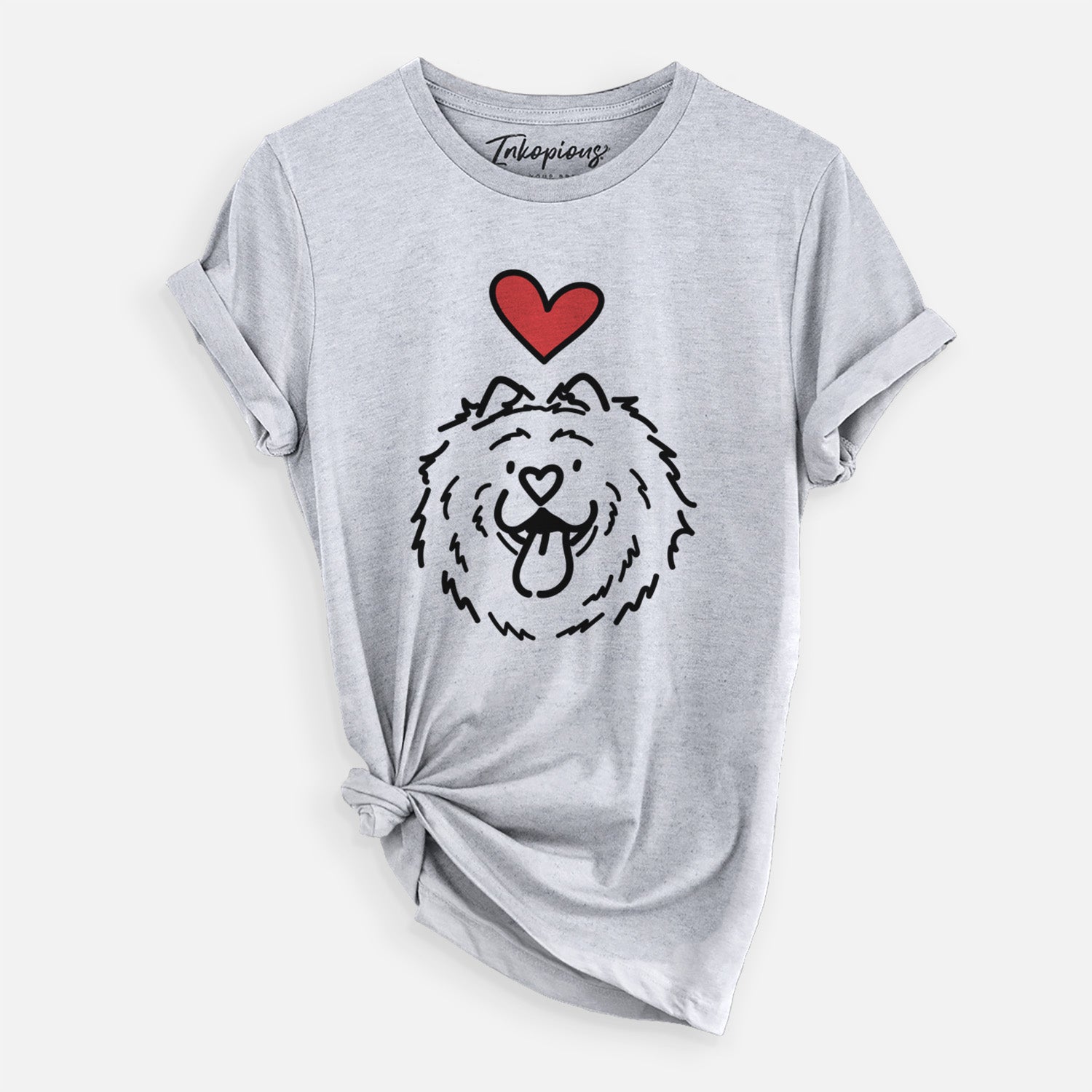 Minimalist line drawing of Bear the Chow Chow with a red heart on a Grey Unisex crewneck, worn by a woman