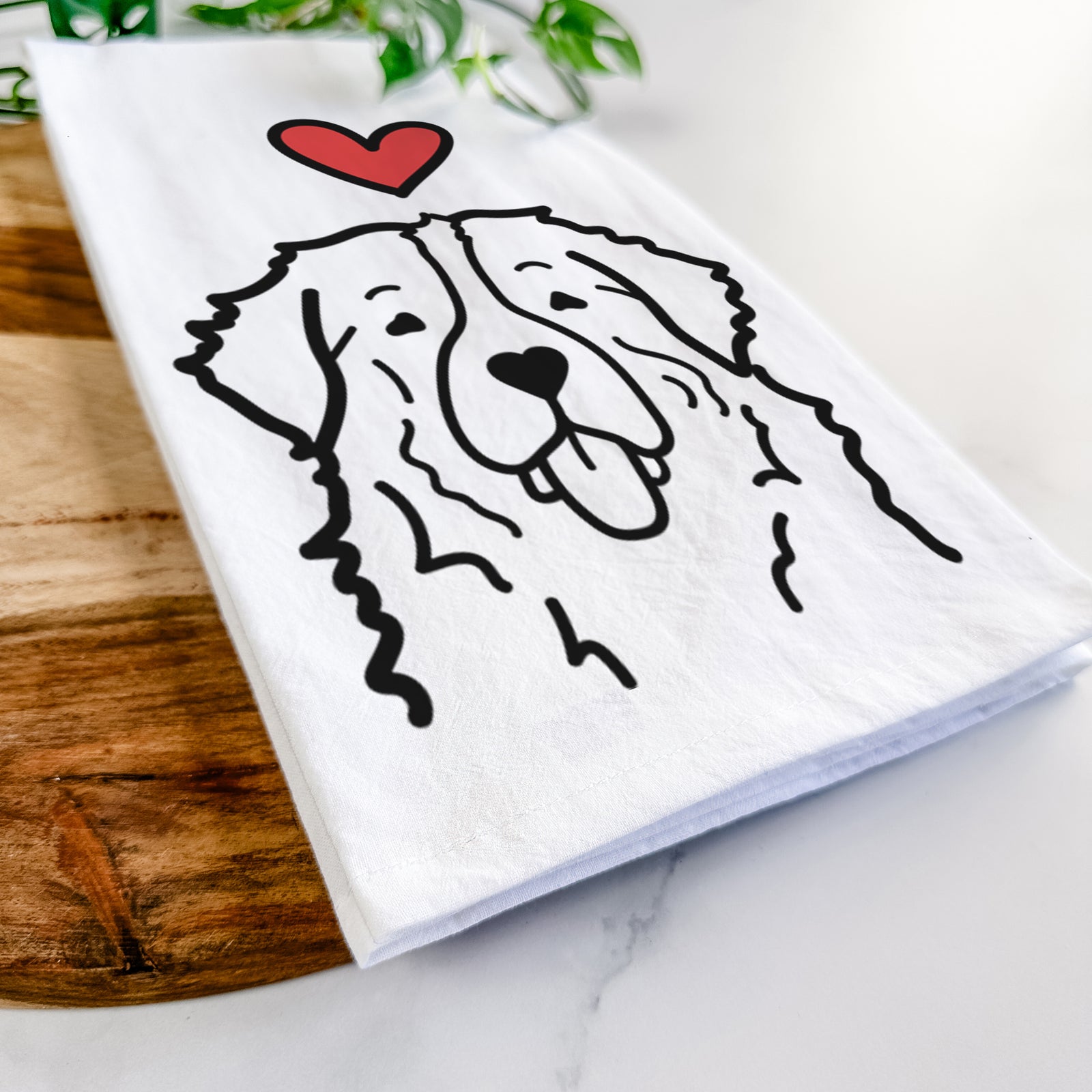 Minimalist line drawing of a Bernese Mountain Dog with a red heart on a tea towel