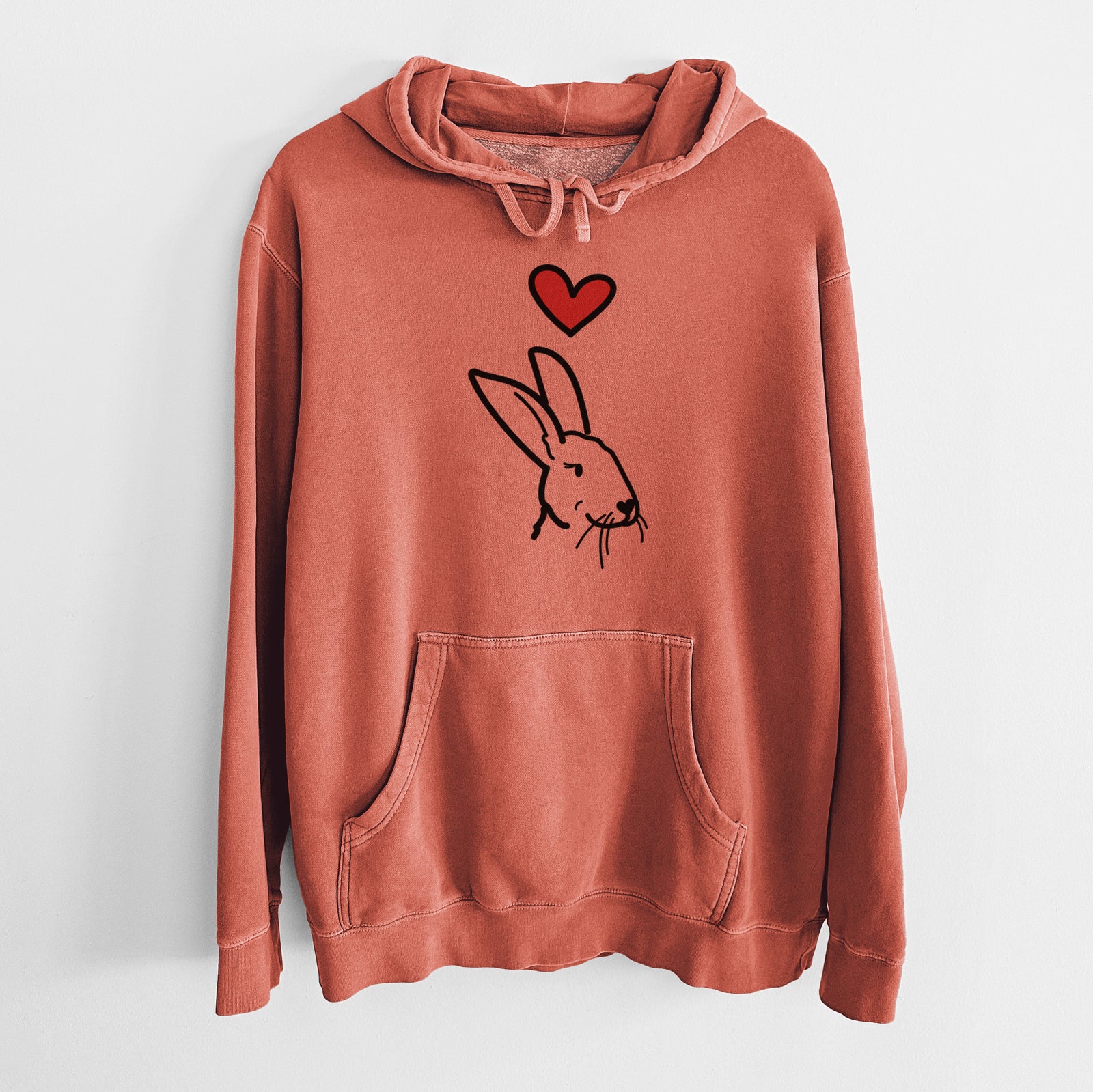 Minimalist line drawing of Betsy the Rex Rabbit with a red heart on an Amber Unisex pigment dyed hoodie