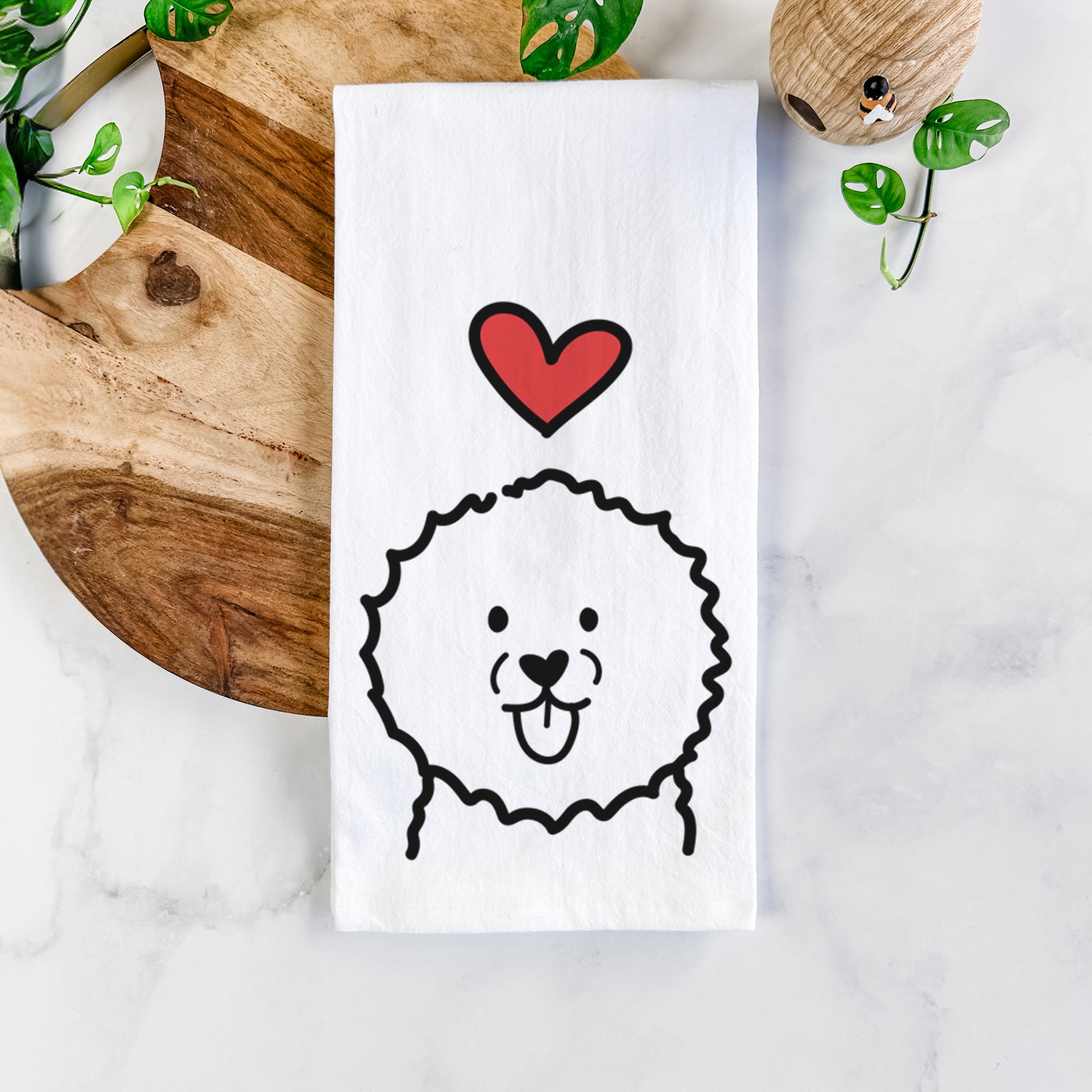 Minimalist line drawing of a Bichon Frise with a red heart on a tea towel
