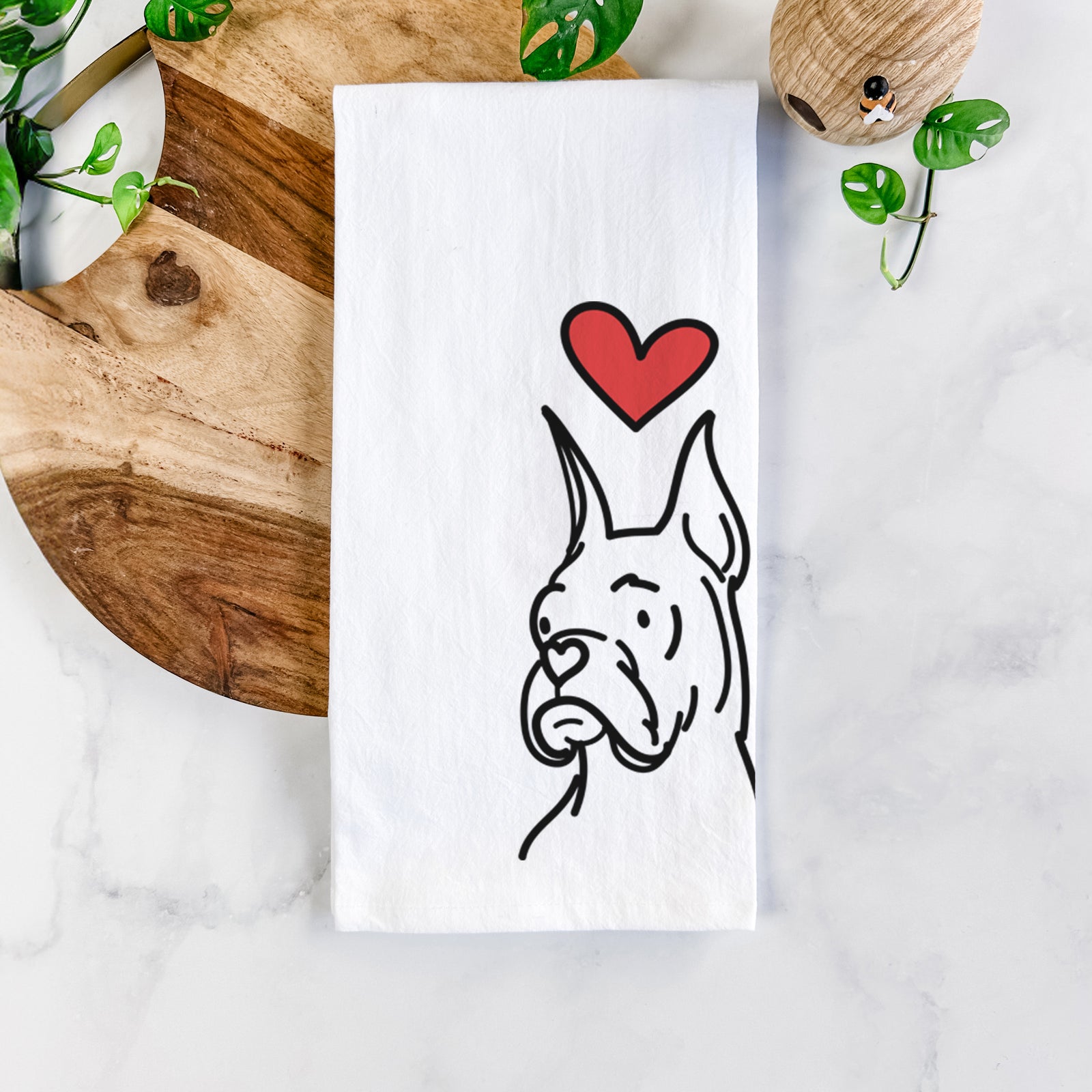 Minimalist line drawing of Billy the Rescue Boxer with a red heart on a tea towel