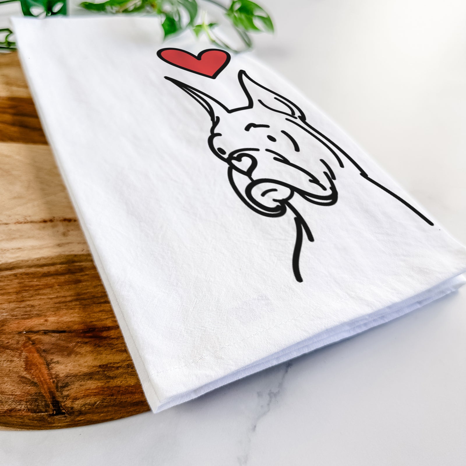 Minimalist line drawing of Billy the Rescue Boxer with a red heart on a tea towel