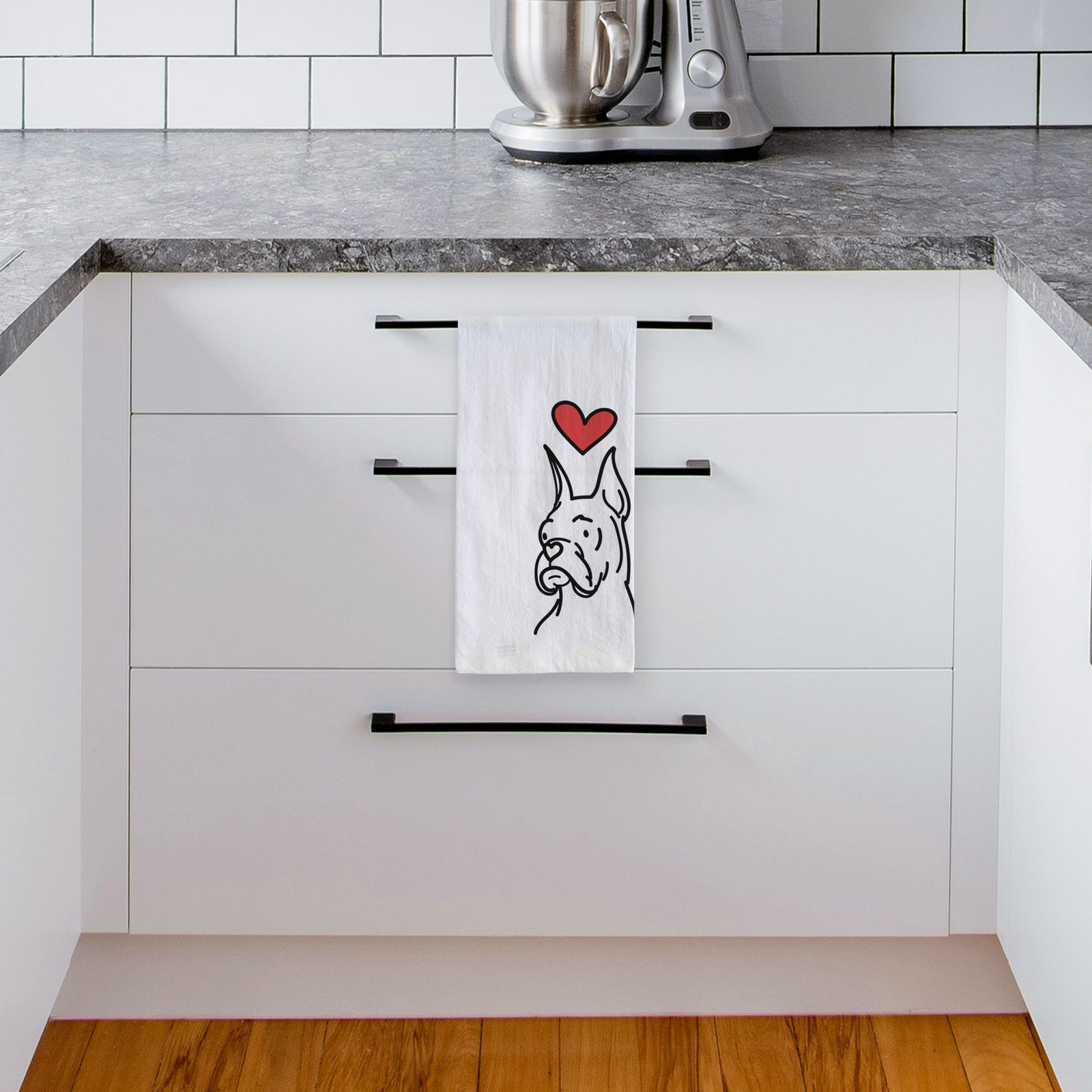 Minimalist line drawing of Billy the Rescue Boxer with a red heart on a tea towel, hanging on an oven door in a kitchen