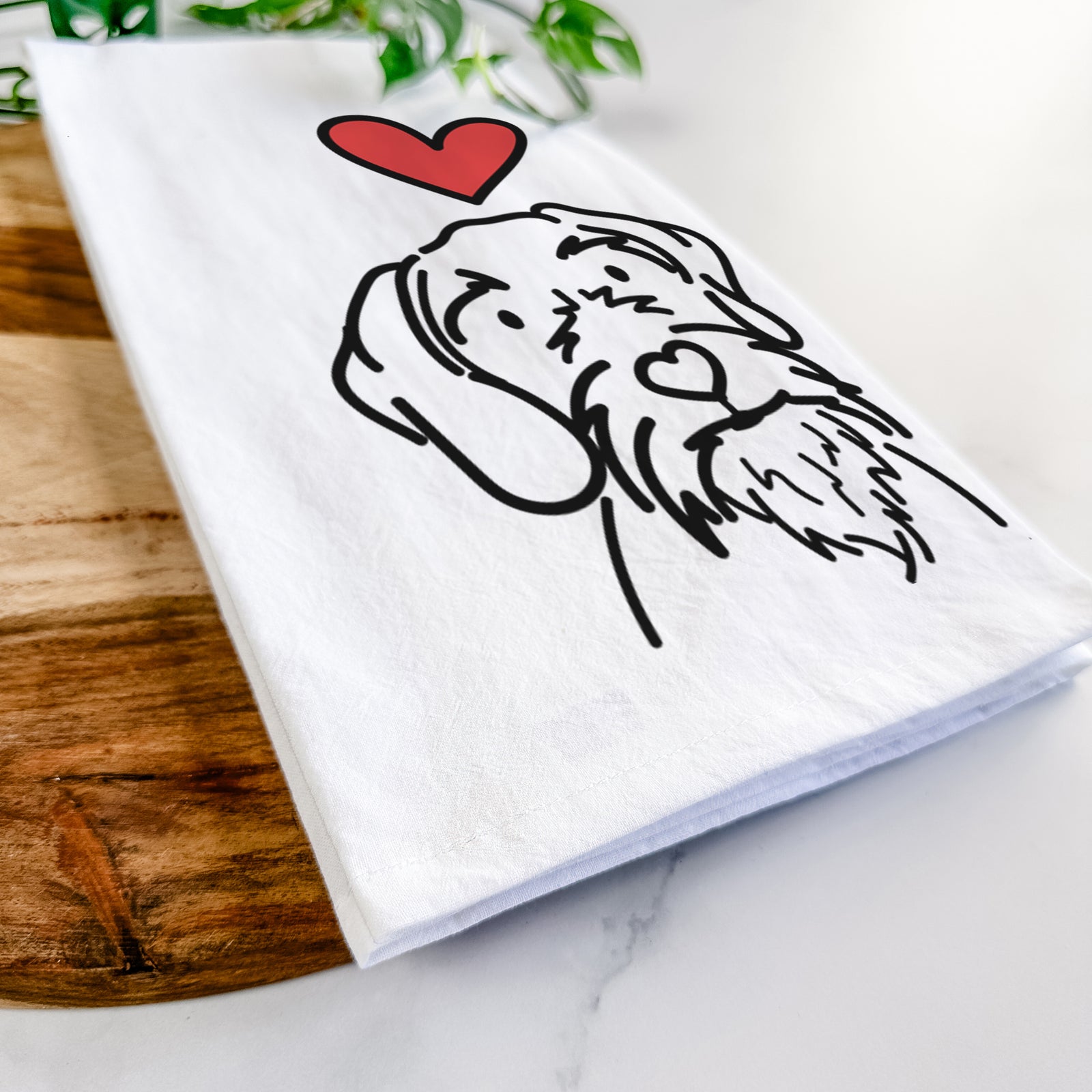 Minimalist line drawing of Buck the German Wirehaired Pointer with a red heart on a tea towel