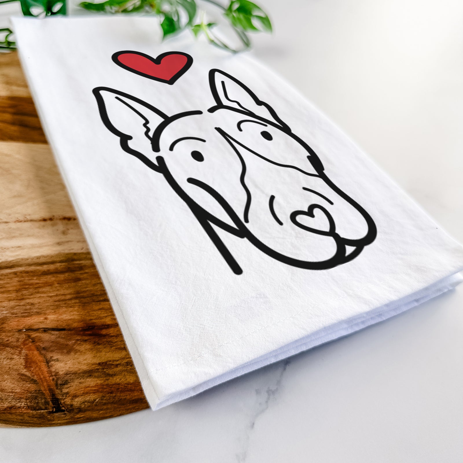Minimalist line drawing of a Bull Terrier with a red heart on a tea towel