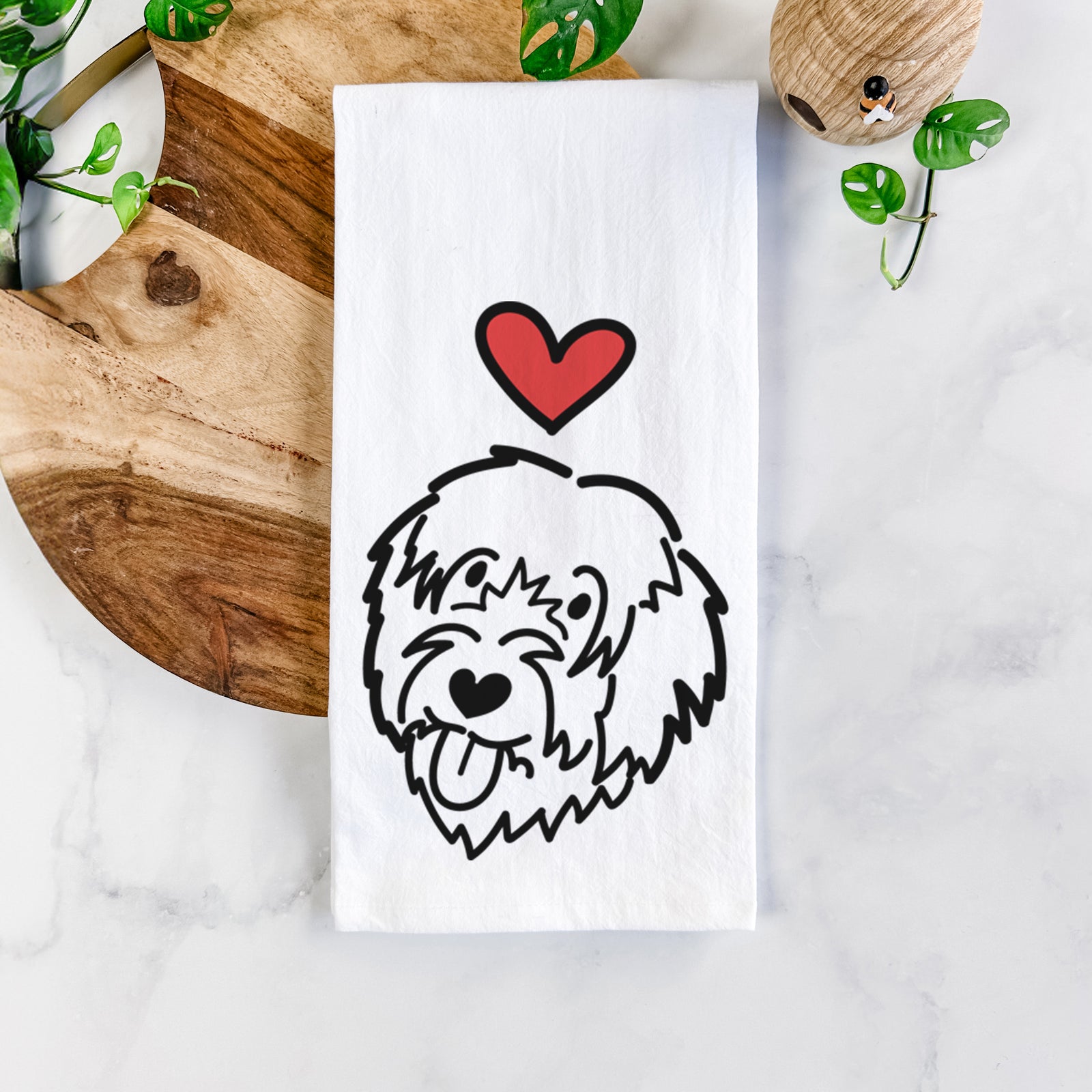 Minimalist line drawing of a Catalan Sheepdog with a red heart on a tea towel