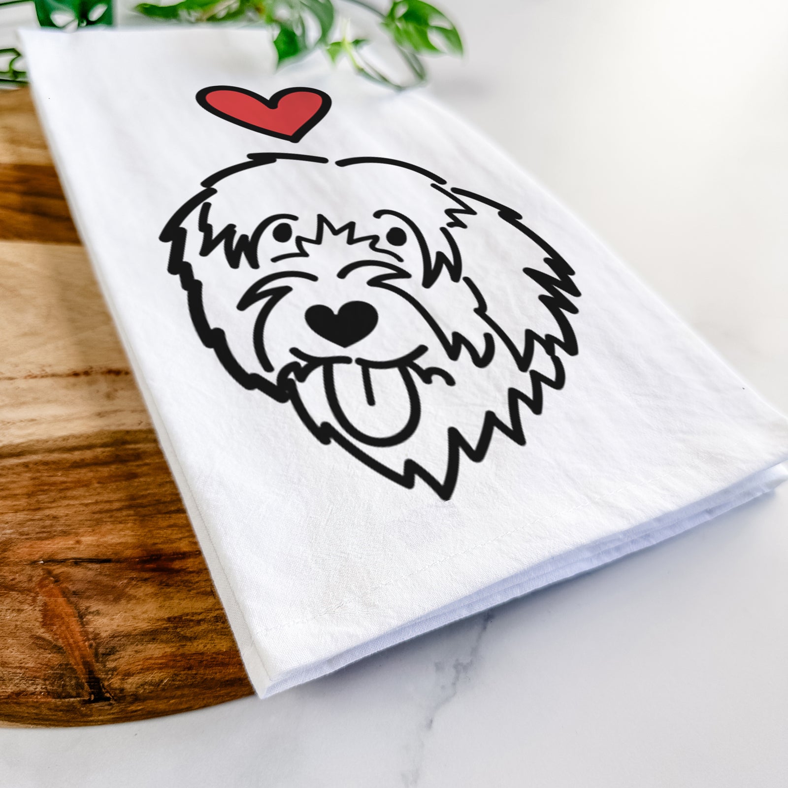 Minimalist line drawing of a Catalan Sheepdog with a red heart on a tea towel