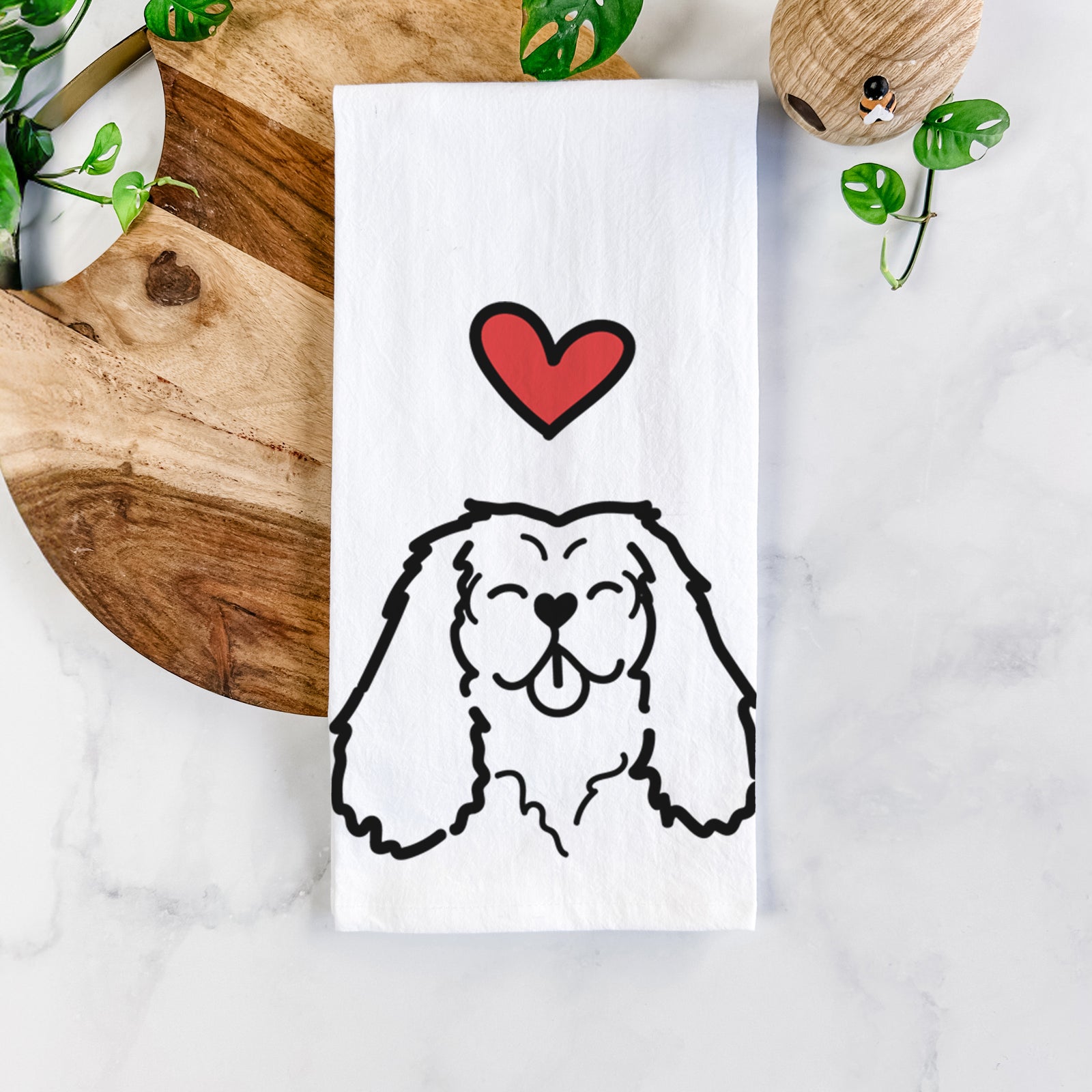 Minimalist line drawing of a Cavalier King Charles Spaniel with a red heart on a tea towel