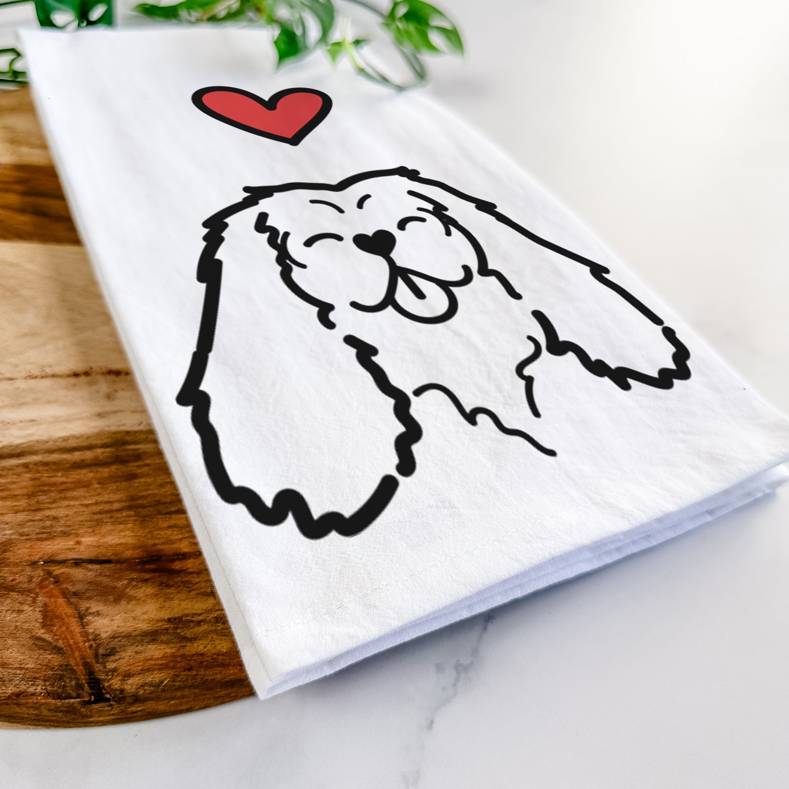 Minimalist line drawing of a Cavalier King Charles Spaniel with a red heart on a tea towel