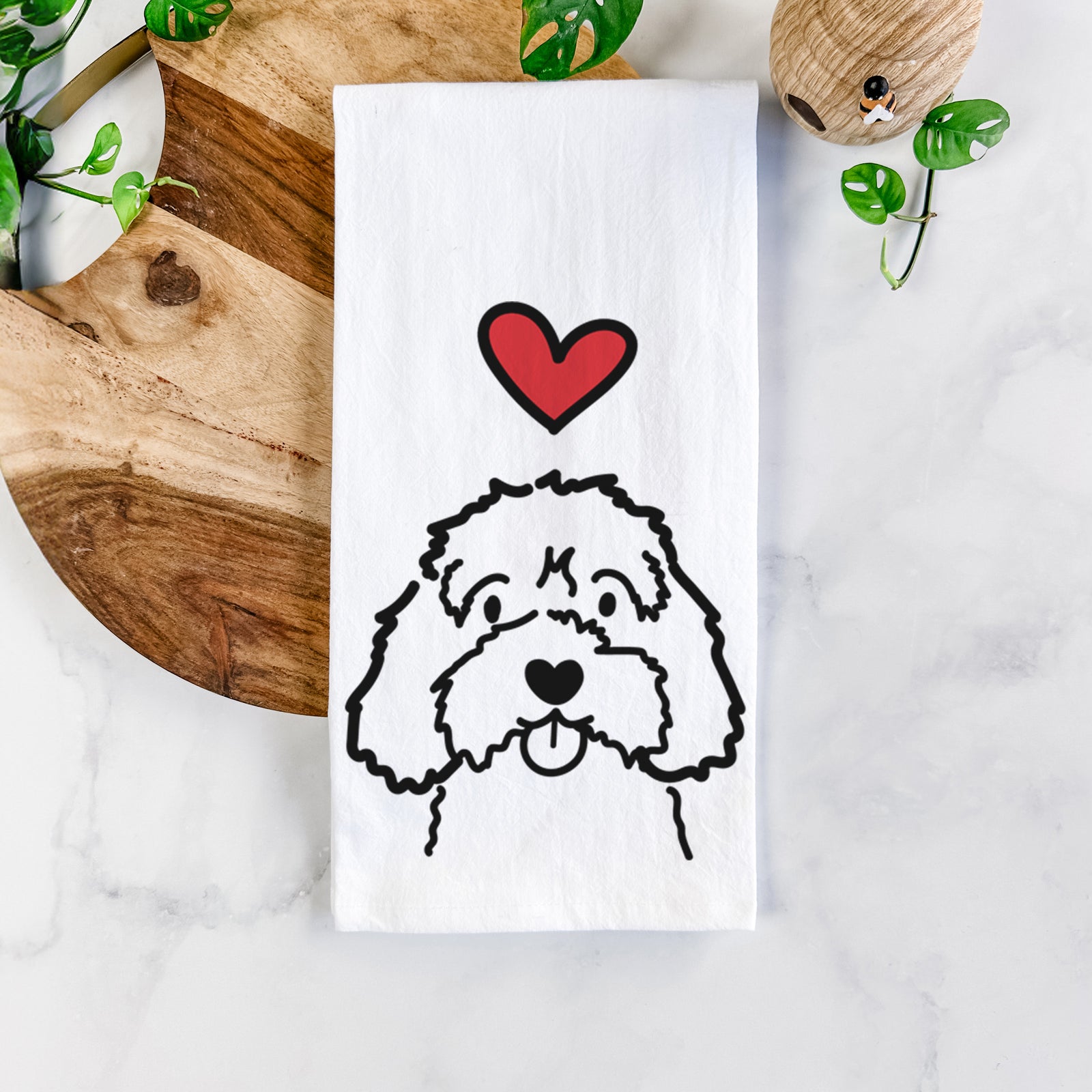 Minimalist line drawing of a Cavapoo with a red heart on a tea towel