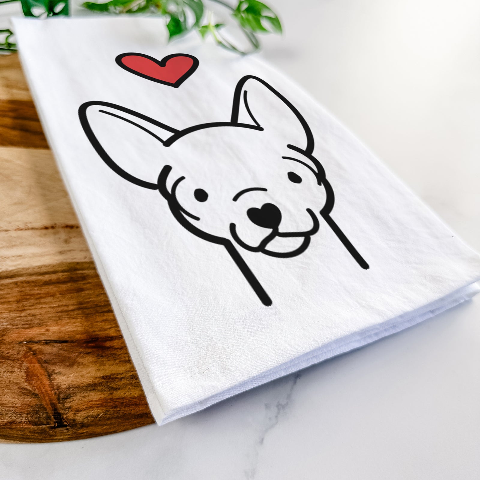 Minimalist line drawing of a Chihuahua with a red heart on a tea towel