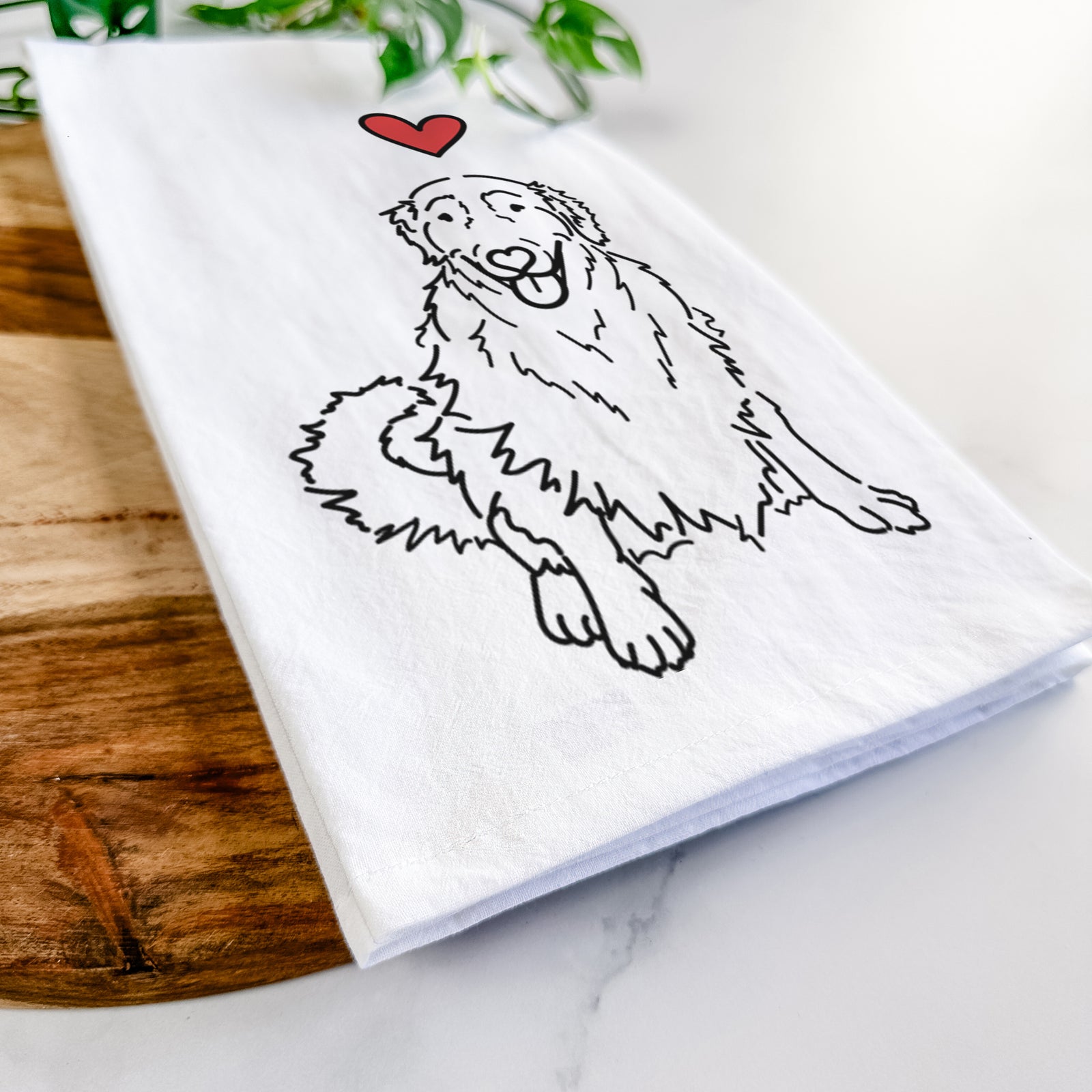 Minimalist line drawing of Daisy the Golden Retriever with a red heart on a tea towel