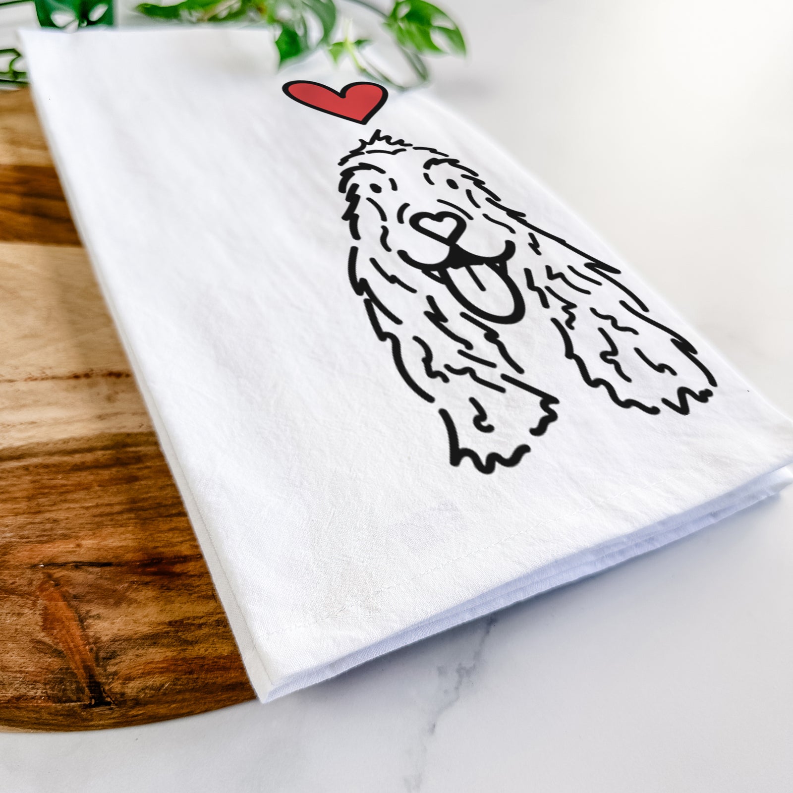 Minimalist line drawing of Dolly the English Cocker Spaniel with a red heart on a tea towel