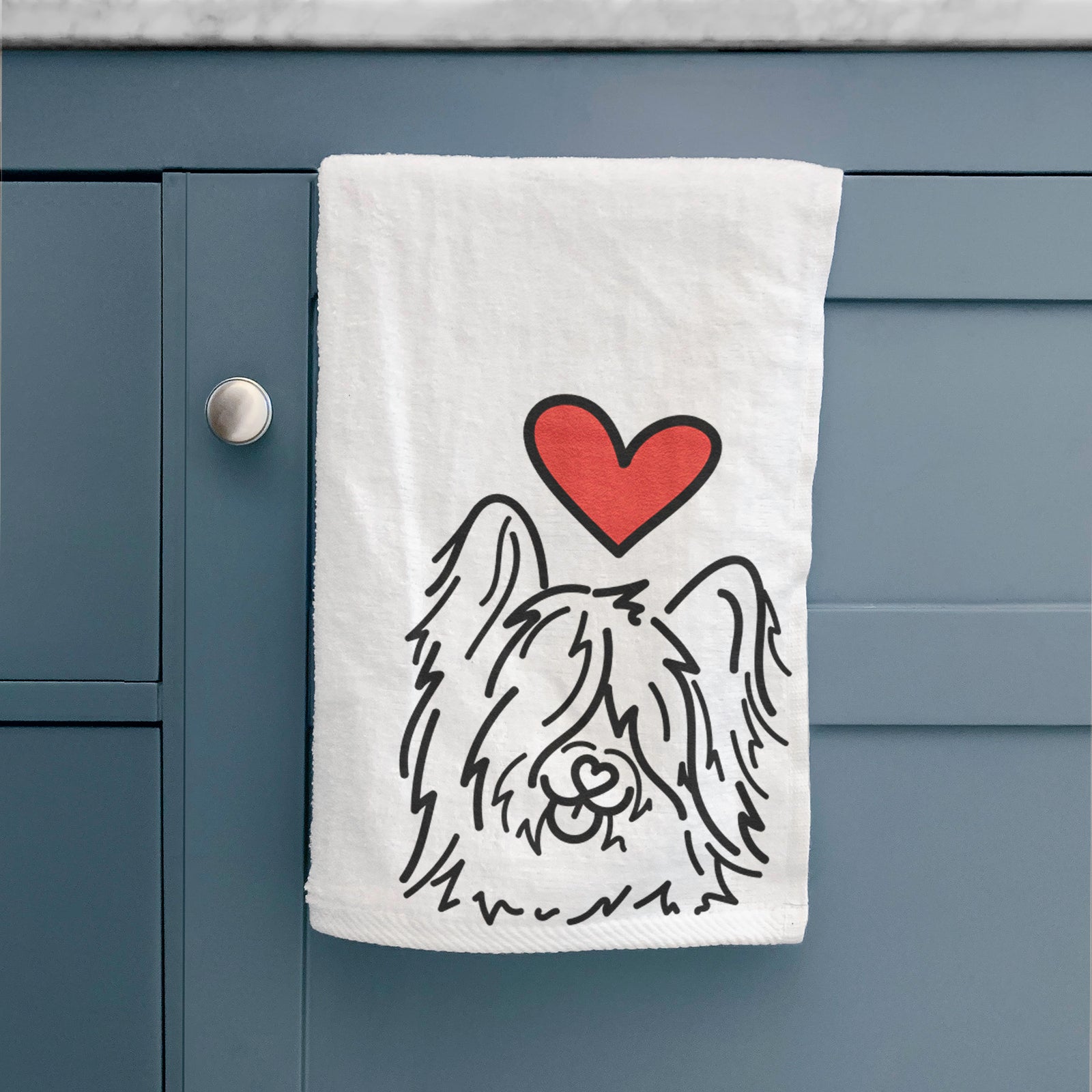 Minimalist line drawing of Dougal the Skye Terrier with a red heart on a hand towel