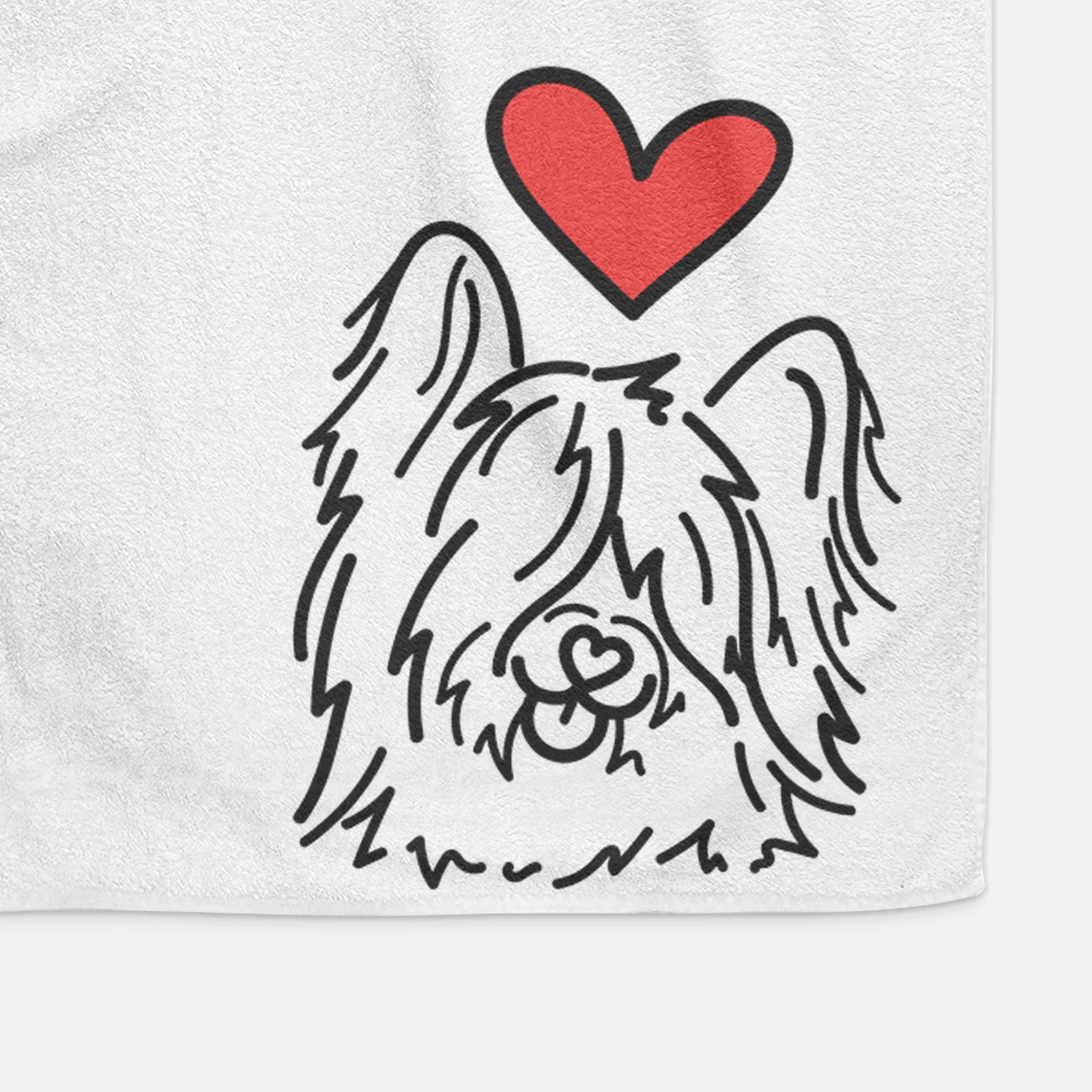 Minimalist line drawing of Dougal the Skye Terrier with a red heart on a hand towel