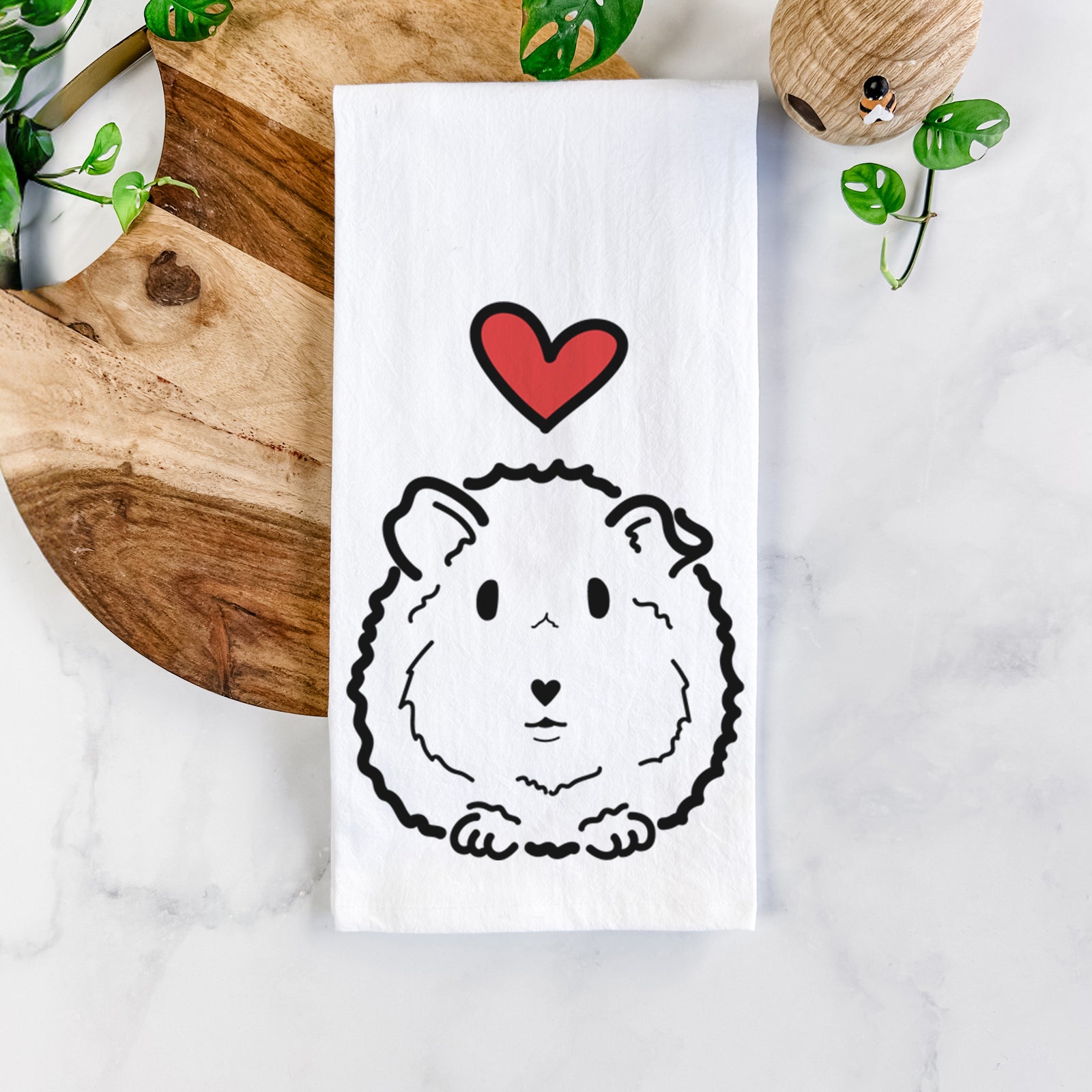 Minimalist line drawing of Duke the Guinea Pig with a red heart on a tea towel