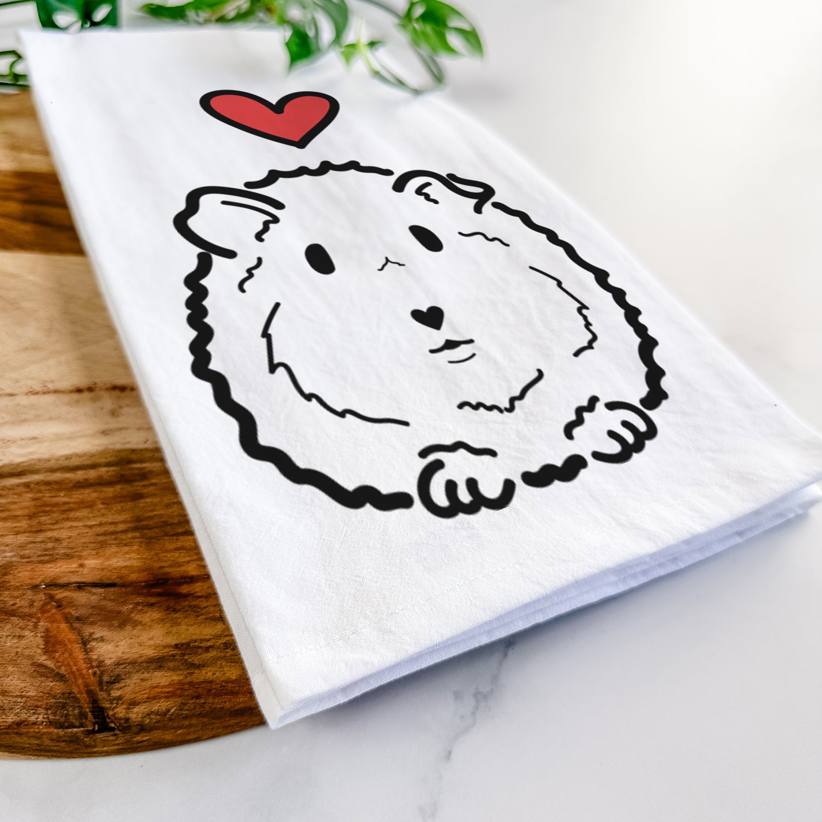 Minimalist line drawing of Duke the Guinea Pig with a red heart on a tea towel