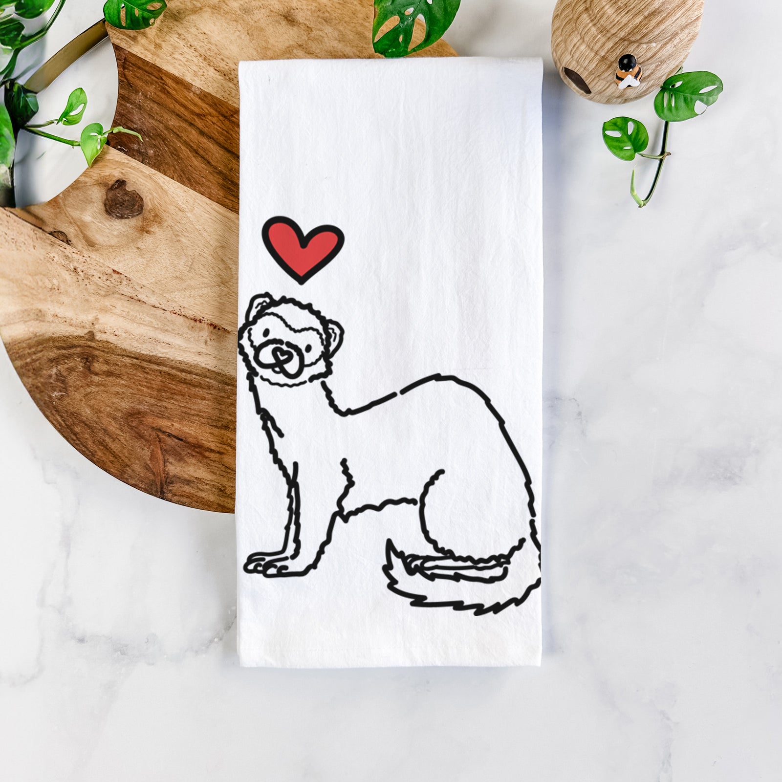Minimalist line drawing of Fern the Ferret with a red heart on a tea towel