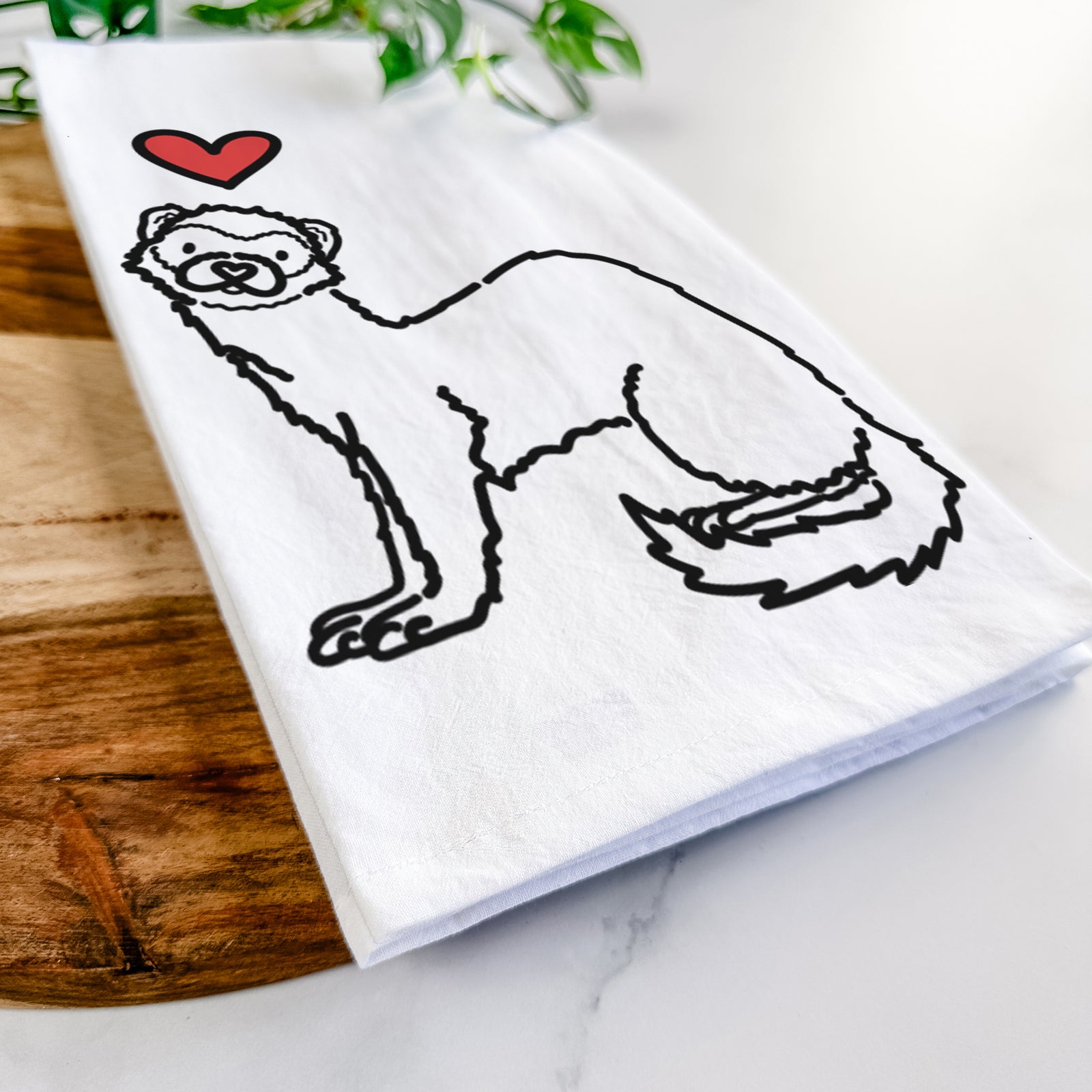 Minimalist line drawing of Fern the Ferret with a red heart on a tea towel