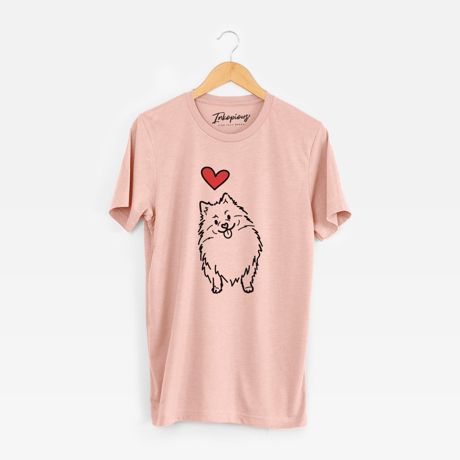 Minimalist line drawing of Fern the Pomeranian with a red heart on a Peach Unisex crewneck