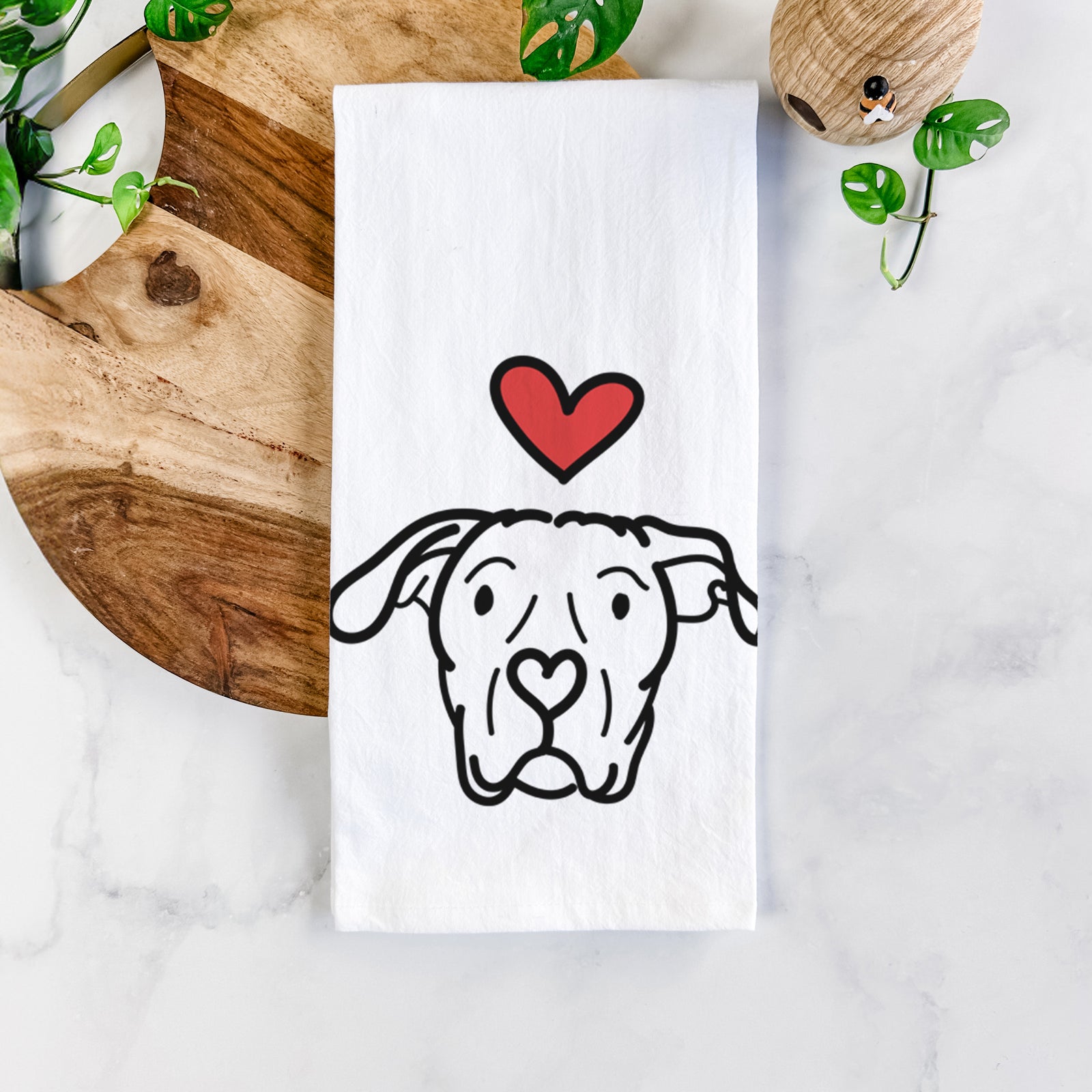 Minimalist line drawing of Genevieve the Dogo Argentino with a red heart on a tea towel