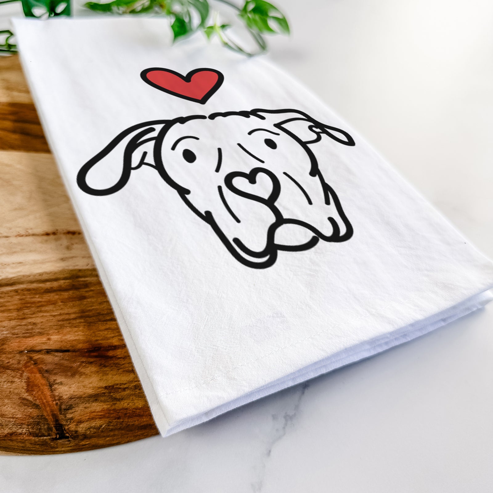 Minimalist line drawing of Genevieve the Dogo Argentino with a red heart on a tea towel