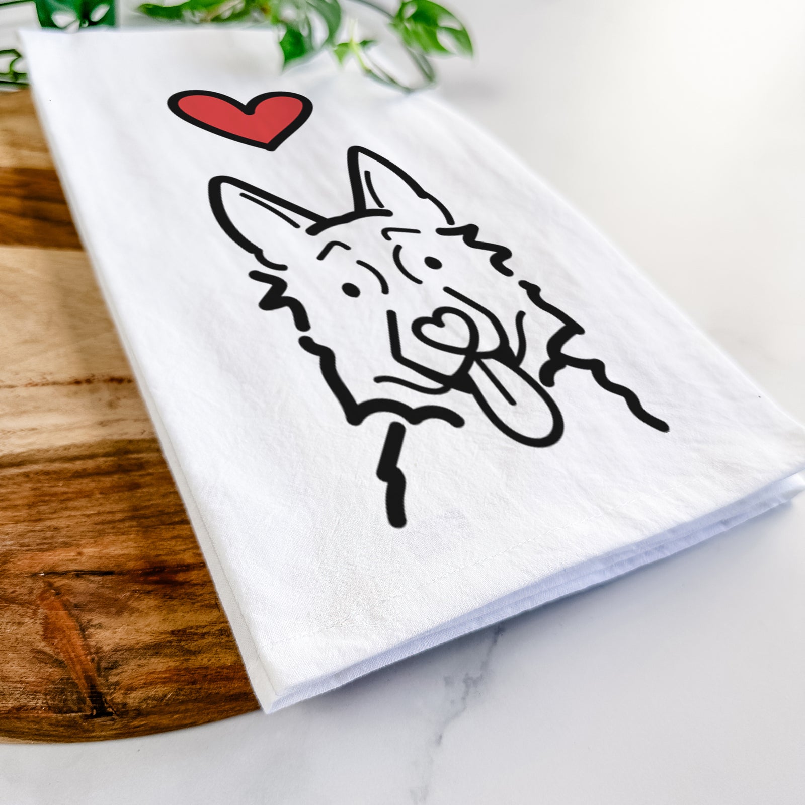 Minimalist line drawing of a German Shepherd with a red heart on a tea towel
