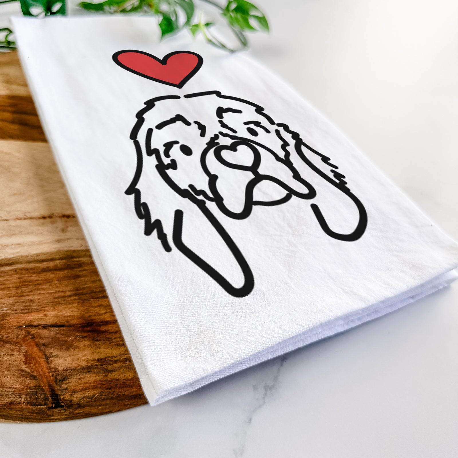 Minimalist line drawing of GiGi the Cocker Spaniel with a red heart on a tea towel
