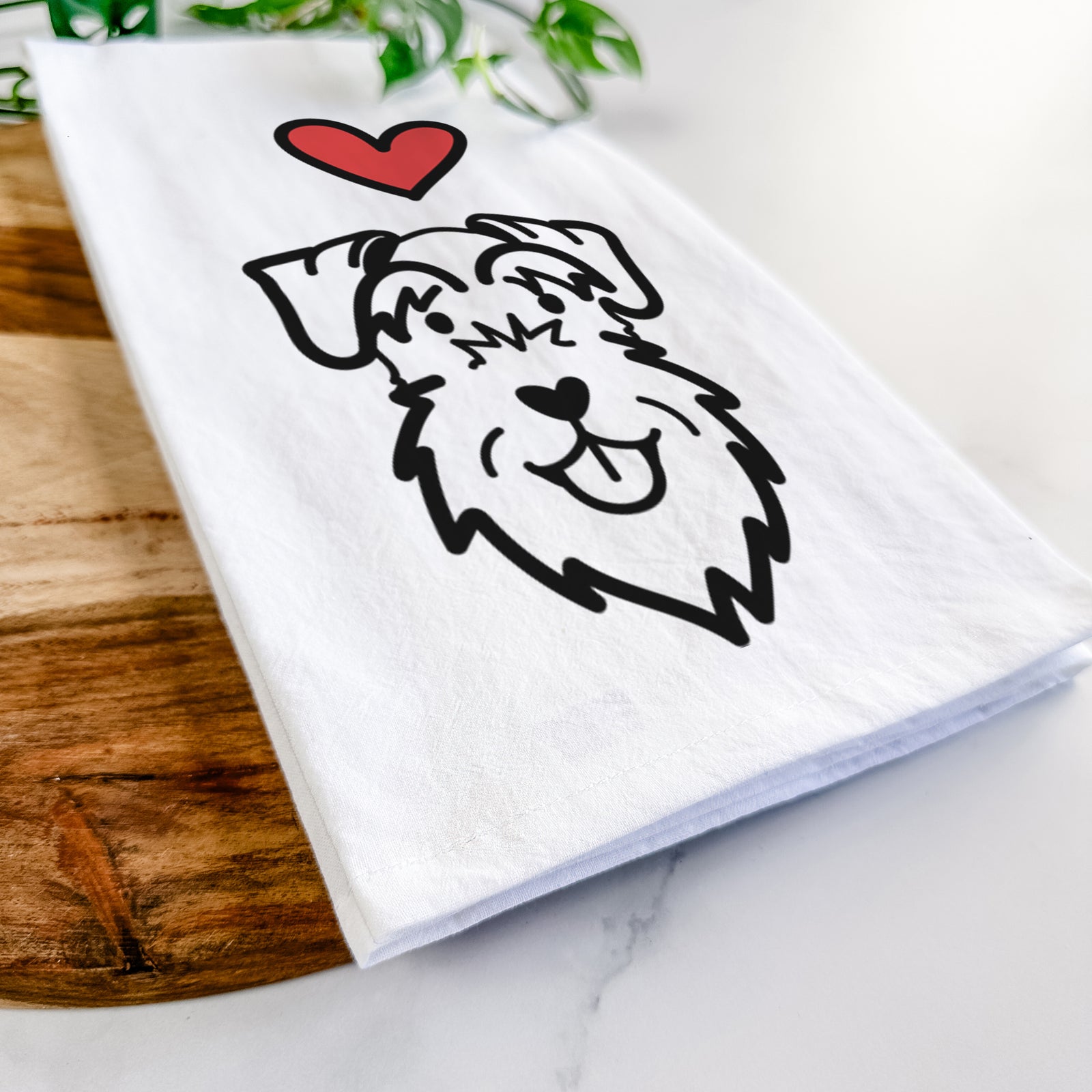 Minimalist line drawing of a Schnauzer Natural Ears with a red heart on a tea towel