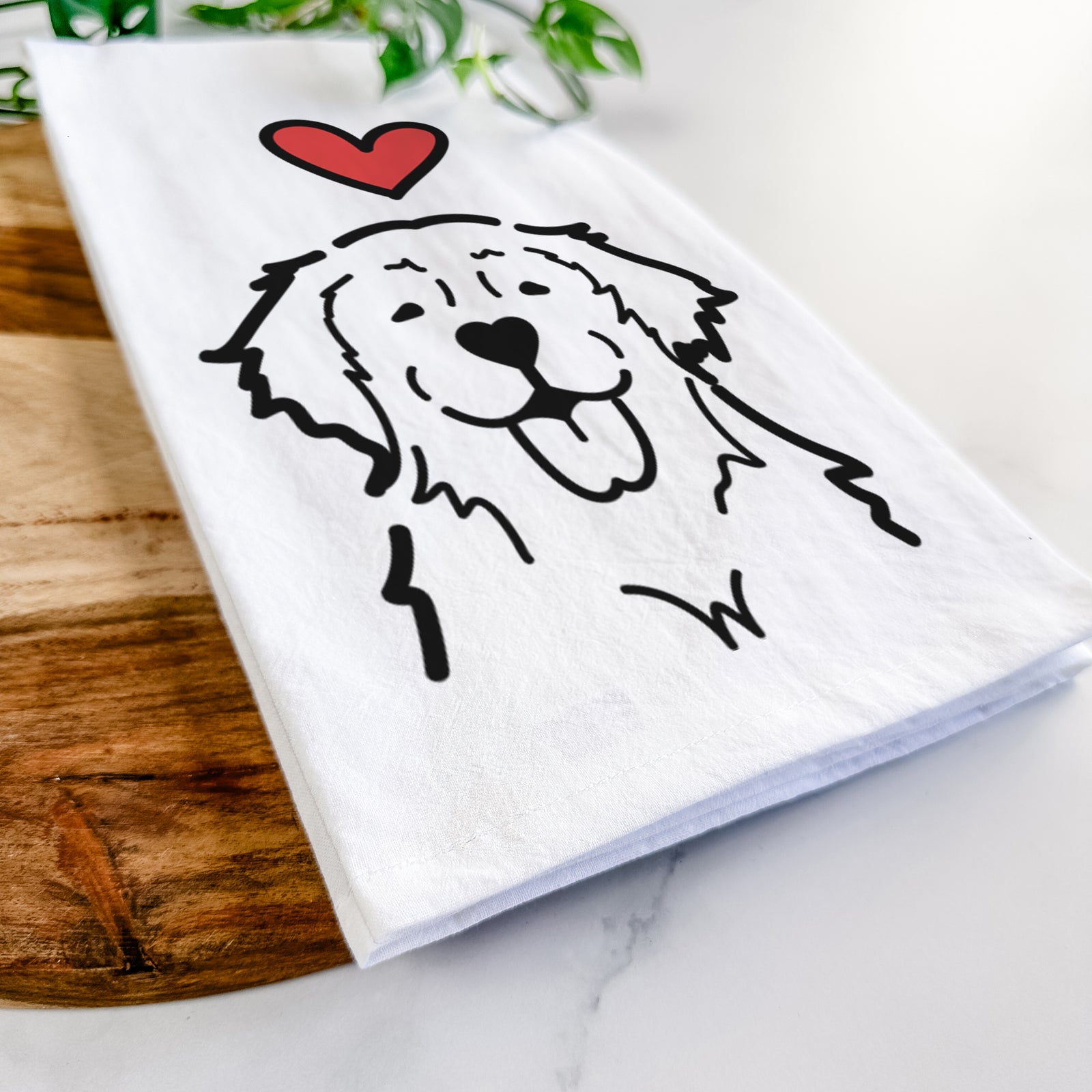 Minimalist line drawing of a Golden Retriever with a red heart on a tea towel