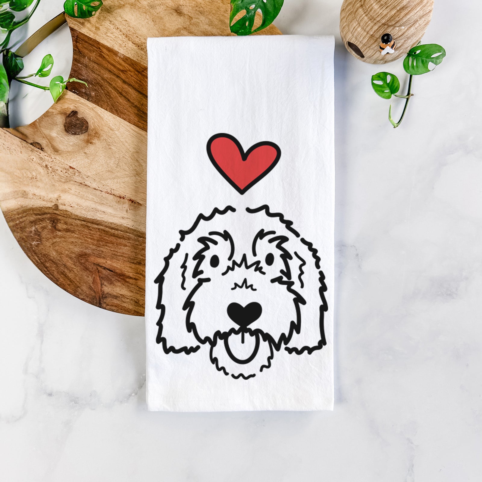 Minimalist line drawing of Gus the Goldendoodle with a red heart on a tea towel