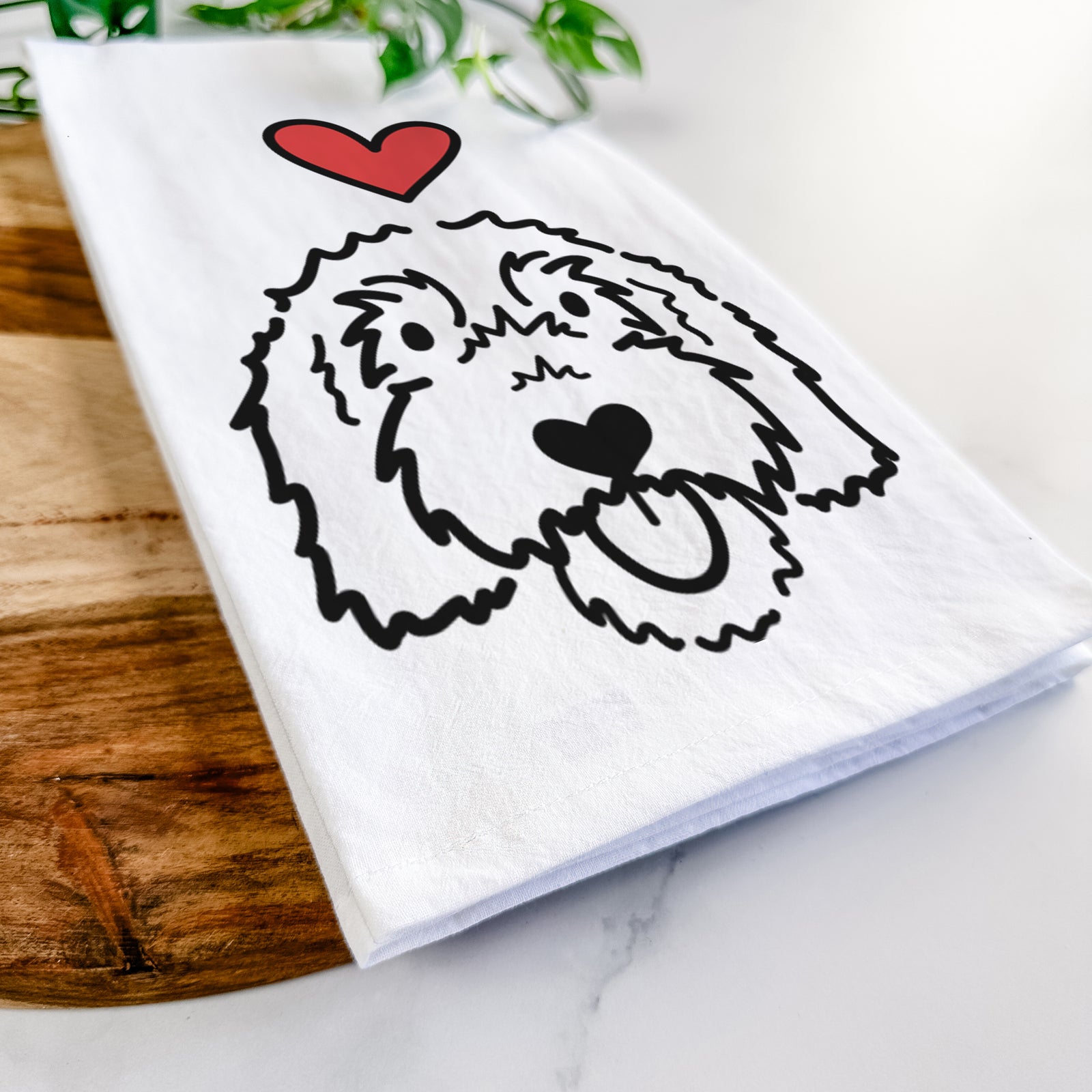 Minimalist line drawing of Gus the Goldendoodle with a red heart on a tea towel