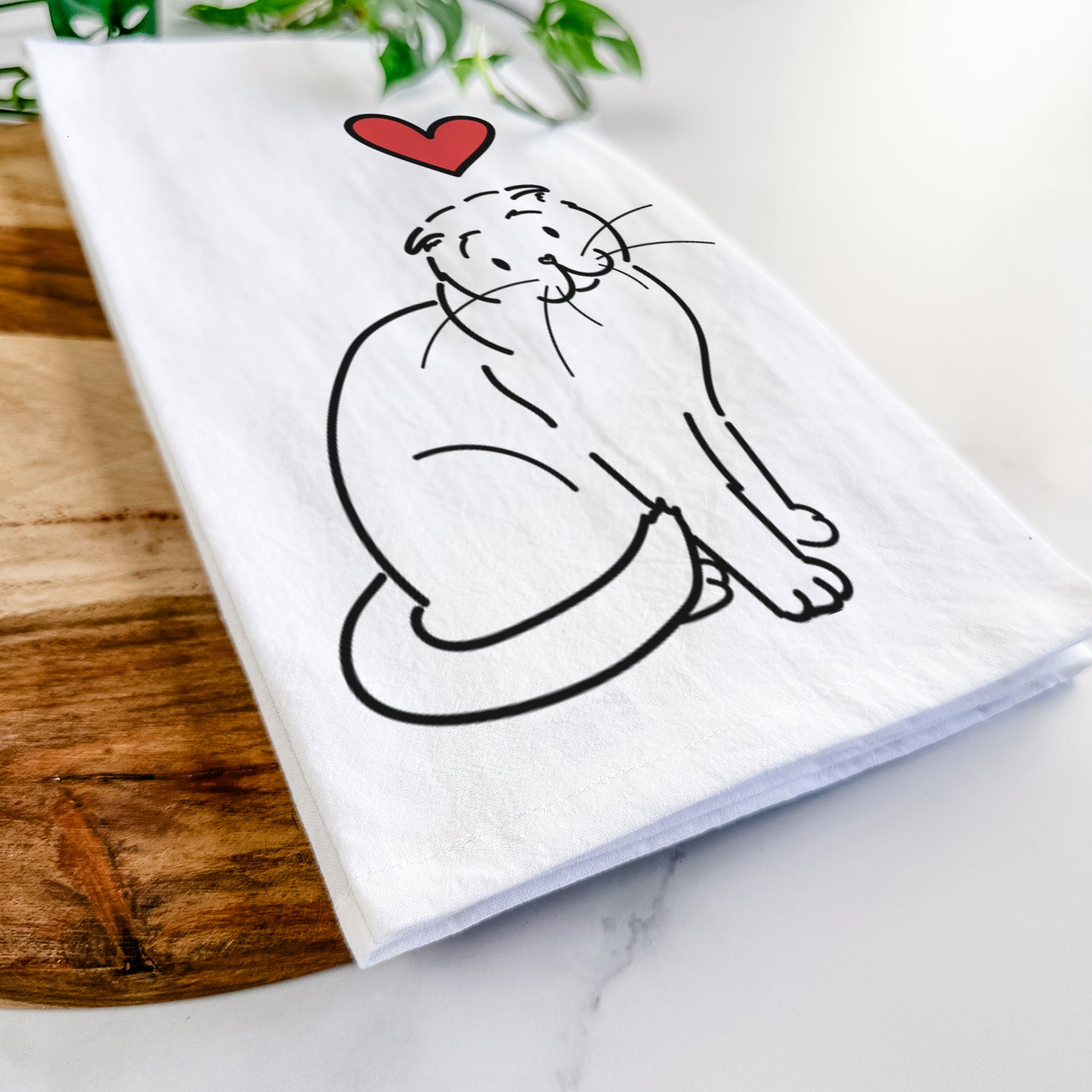 Minimalist line drawing of Hank the Scottish Fold Cat with a red heart on a tea towel