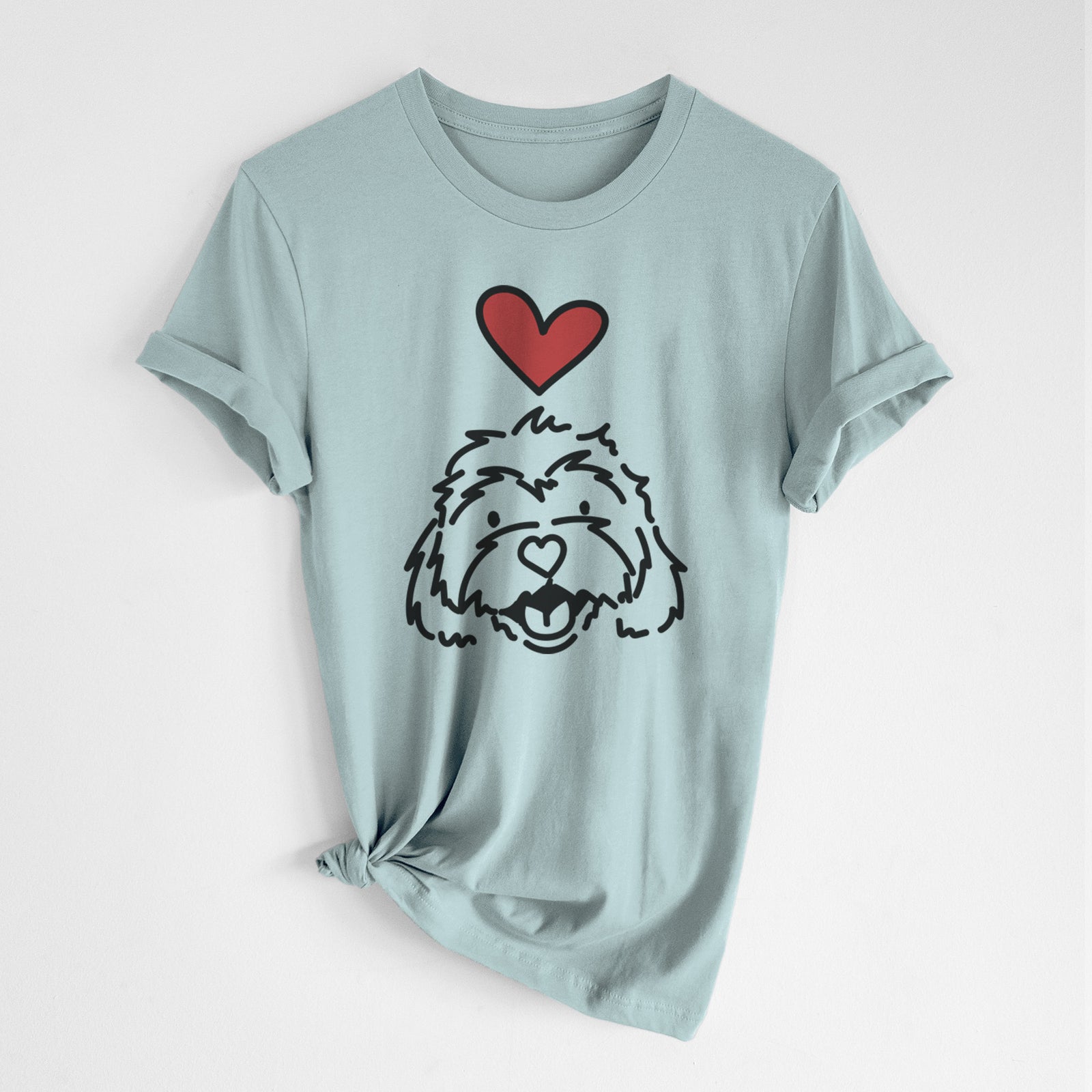Minimalist line drawing of Harry the Cavachon with a red heart on a Dusty Blue Unisex crewneck, worn by a woman