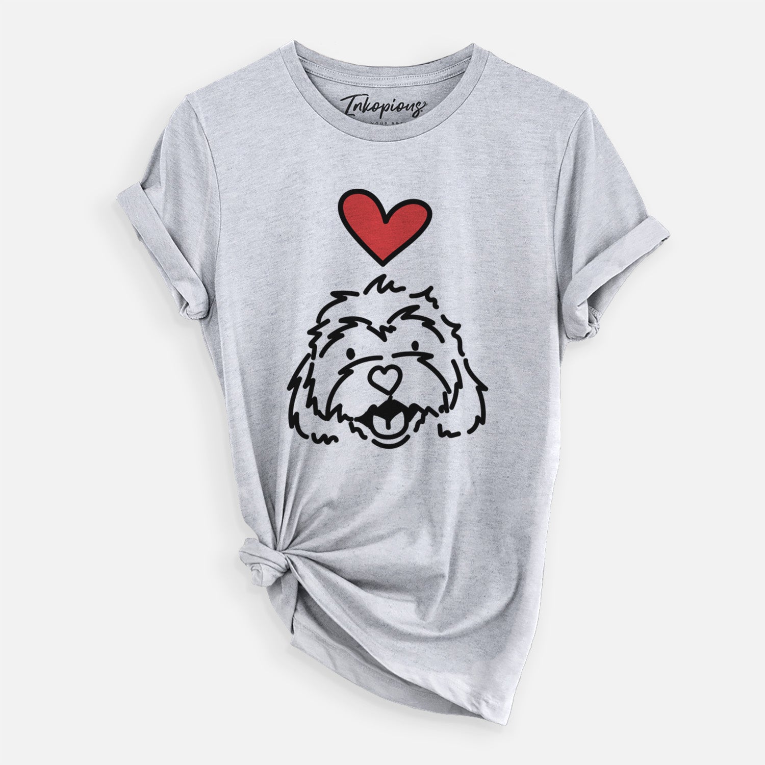 Minimalist line drawing of Harry the Cavachon with a red heart on a Grey Unisex crewneck, worn by a woman