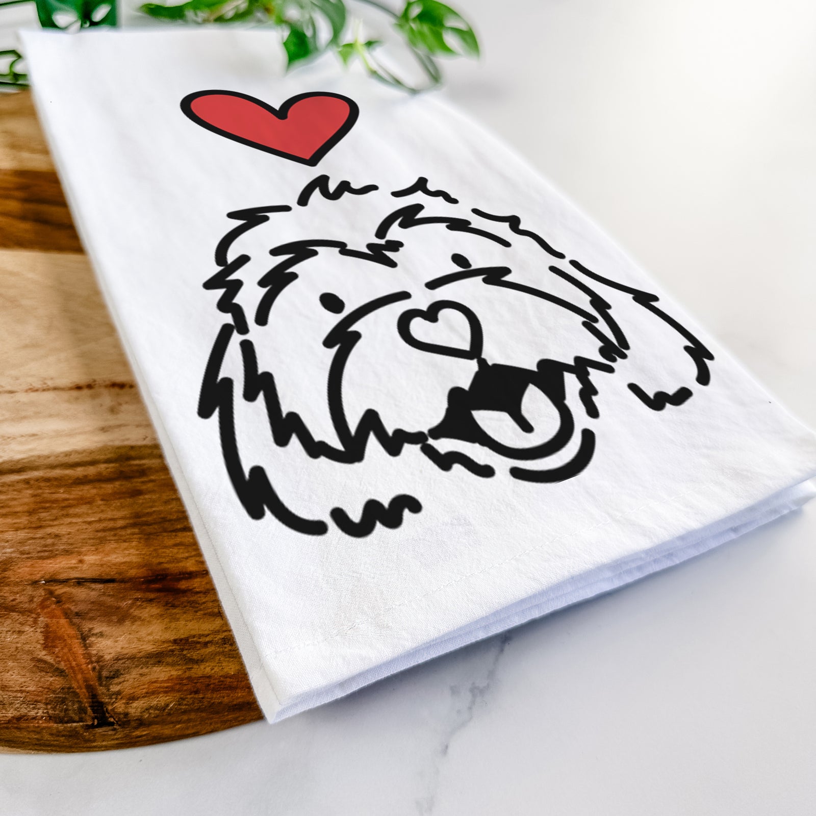 Minimalist line drawing of Harry the Cavachon with a red heart on a tea towel