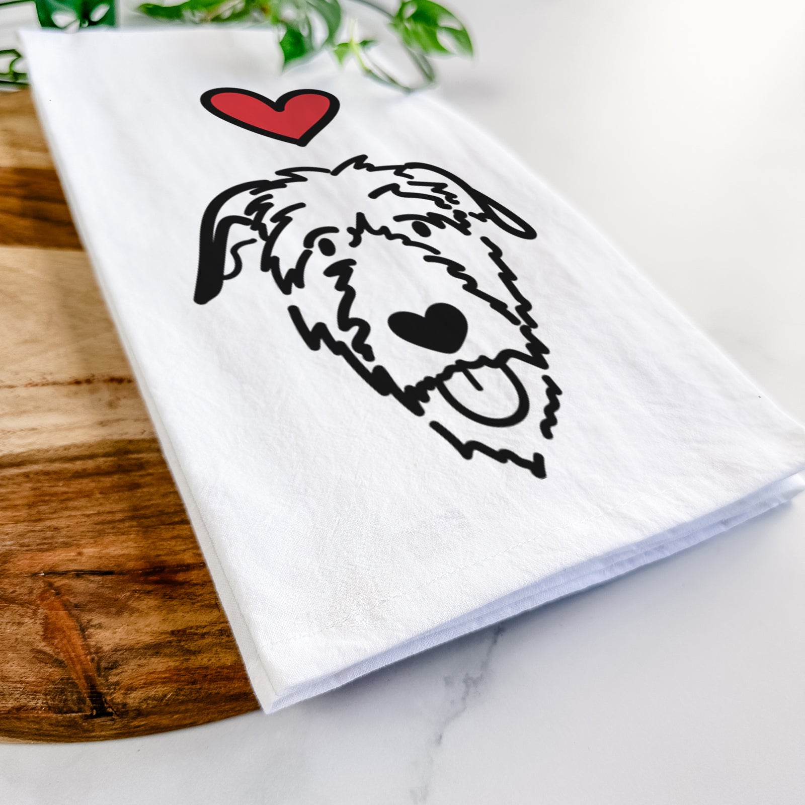 Minimalist line drawing of an Irish Wolfhound with a red heart on a tea towel