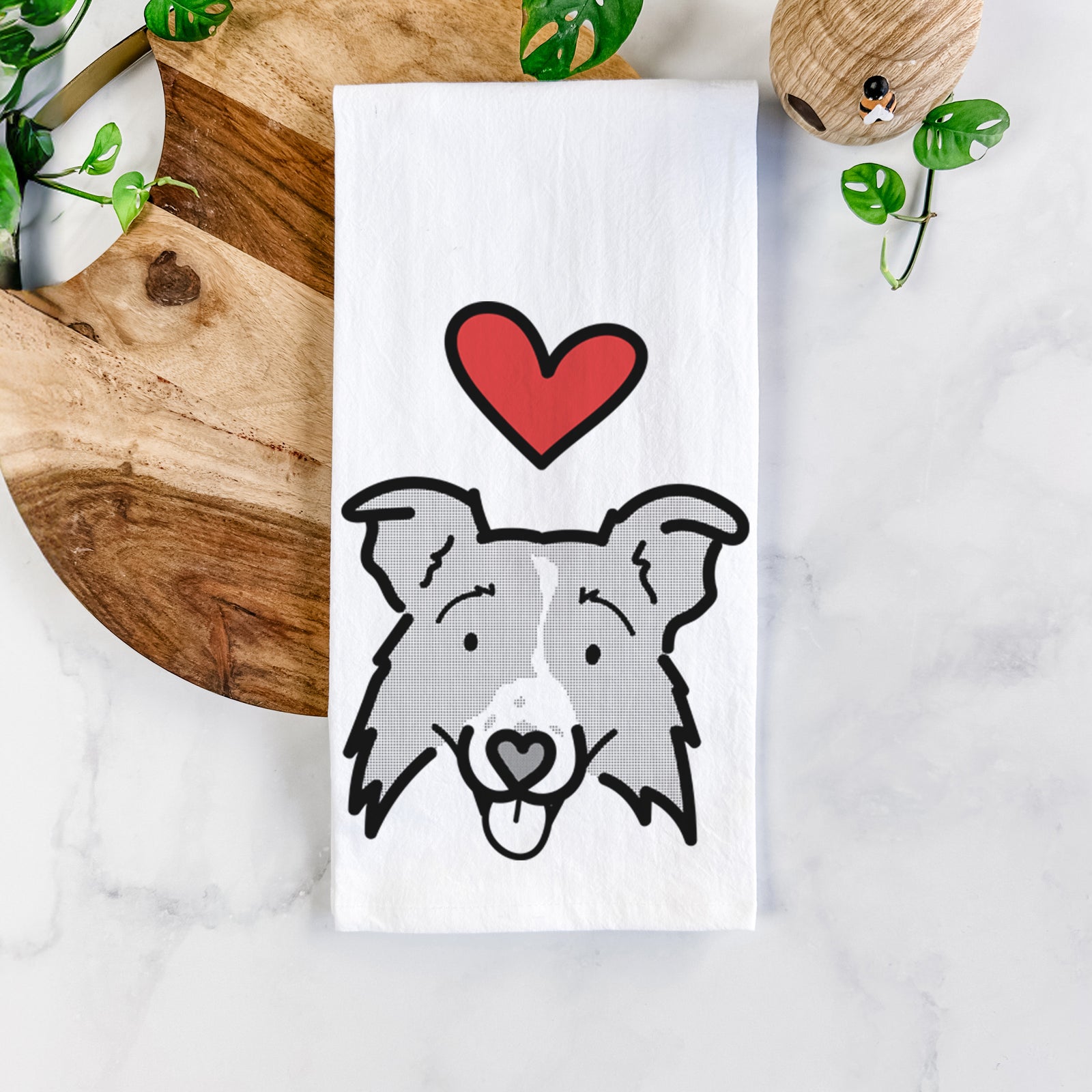 Minimalist line drawing of Jam the Border Collie 2.0 with a red heart on a tea towel