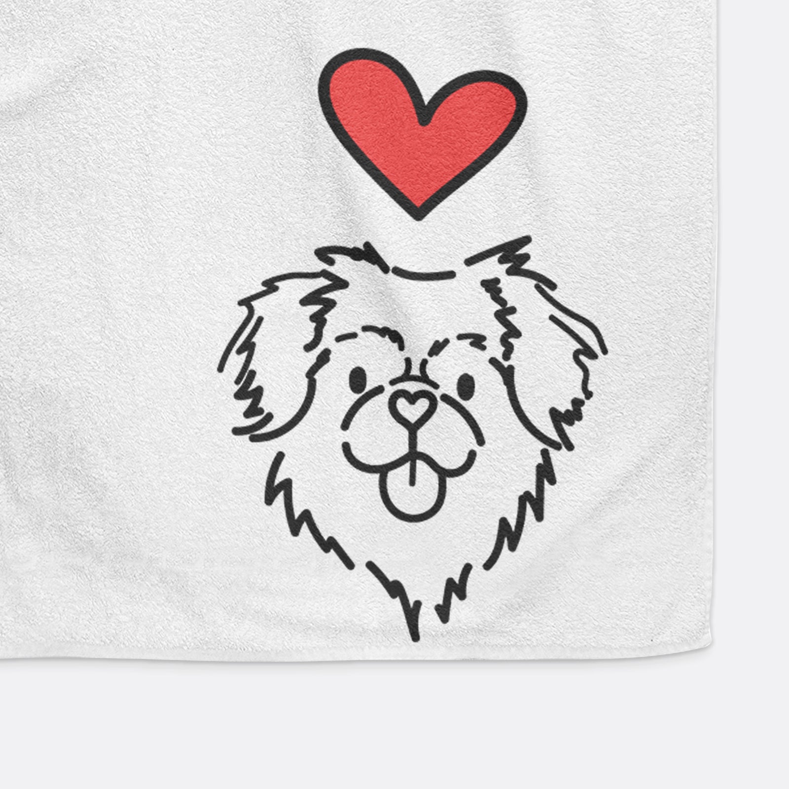 Minimalist line drawing of Jiji the Tibetan Spaniel with a red heart on a decorative hand towel