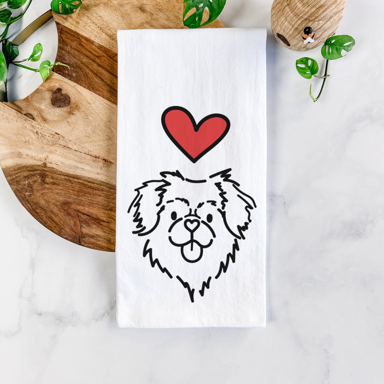 Minimalist line drawing of Jiji the Tibetan Spaniel with a red heart on a tea towel