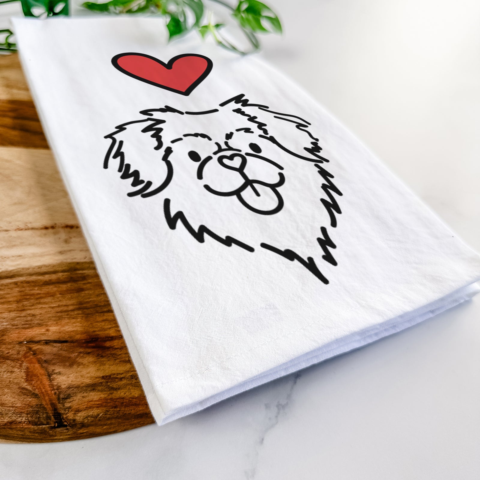 Minimalist line drawing of Jiji the Tibetan Spaniel with a red heart on a tea towel