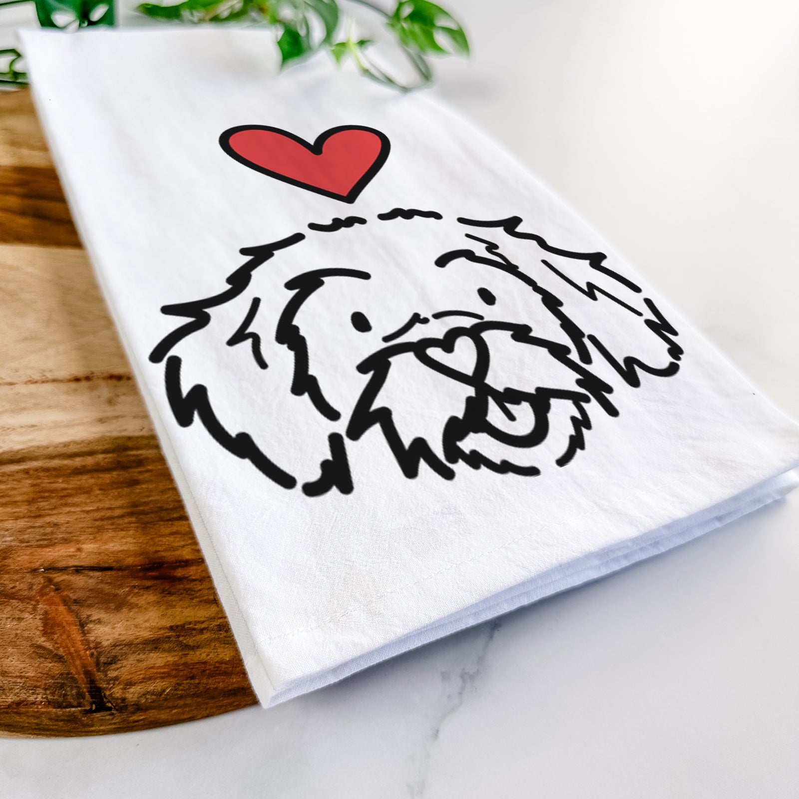 Minimalist line drawing of Jo Jo the Peekapoo with a red heart on a tea towel