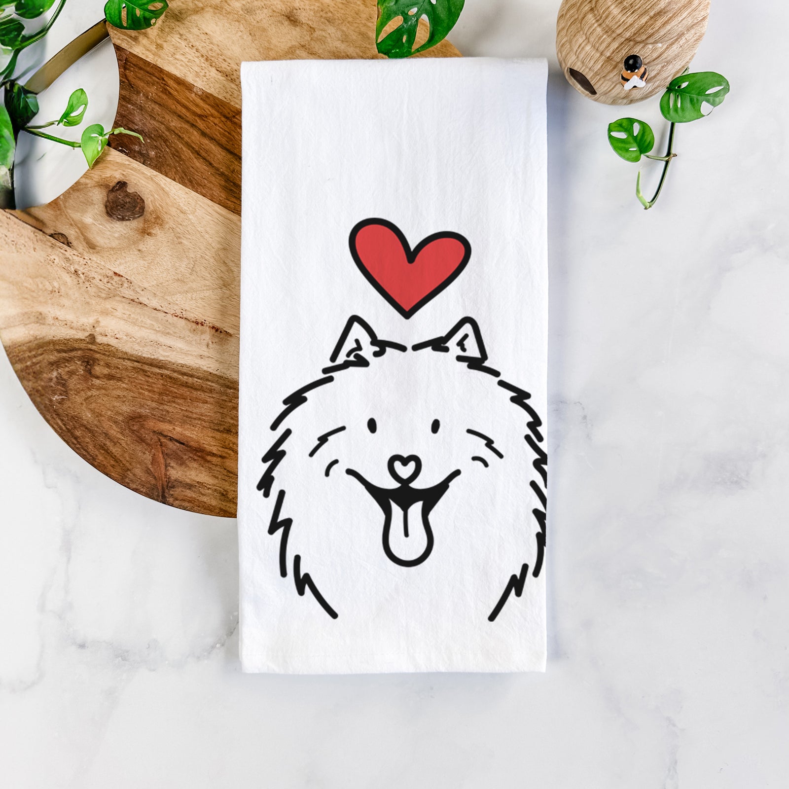 Minimalist line drawing of Johnny the Samoyed with a red heart on a tea towel