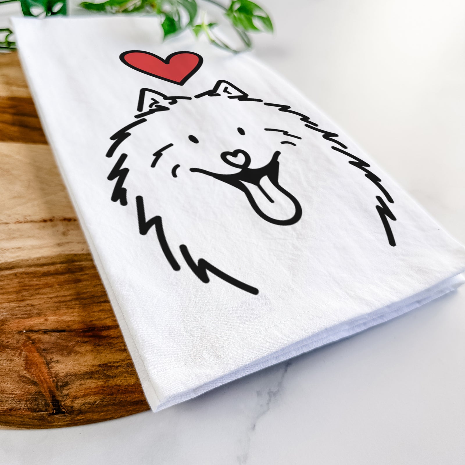 Minimalist line drawing of Johnny the Samoyed with a red heart on a tea towel