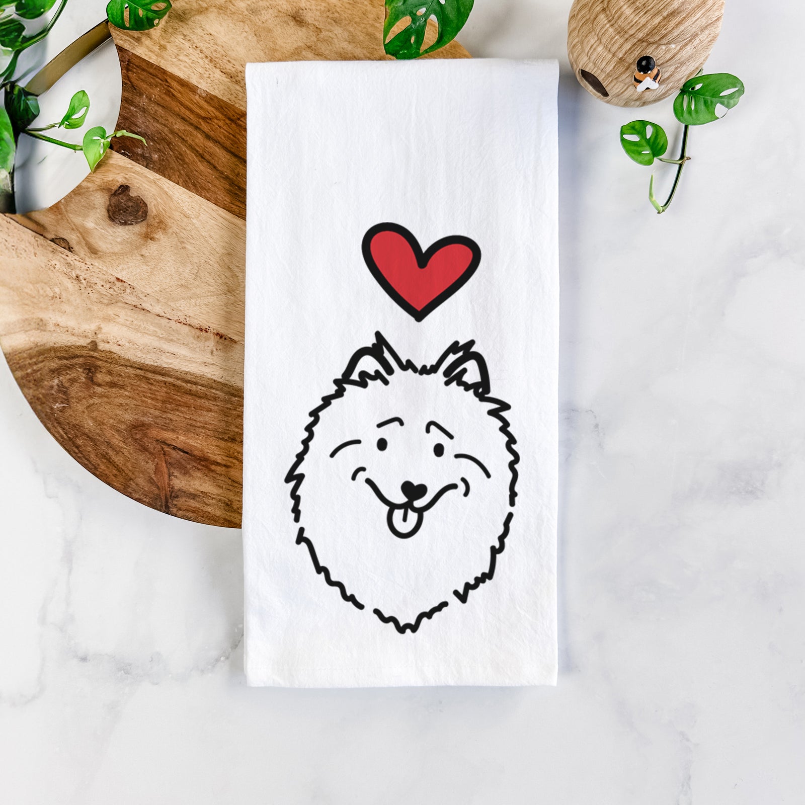 Minimalist line drawing of a Keeshond with a red heart on a tea towel