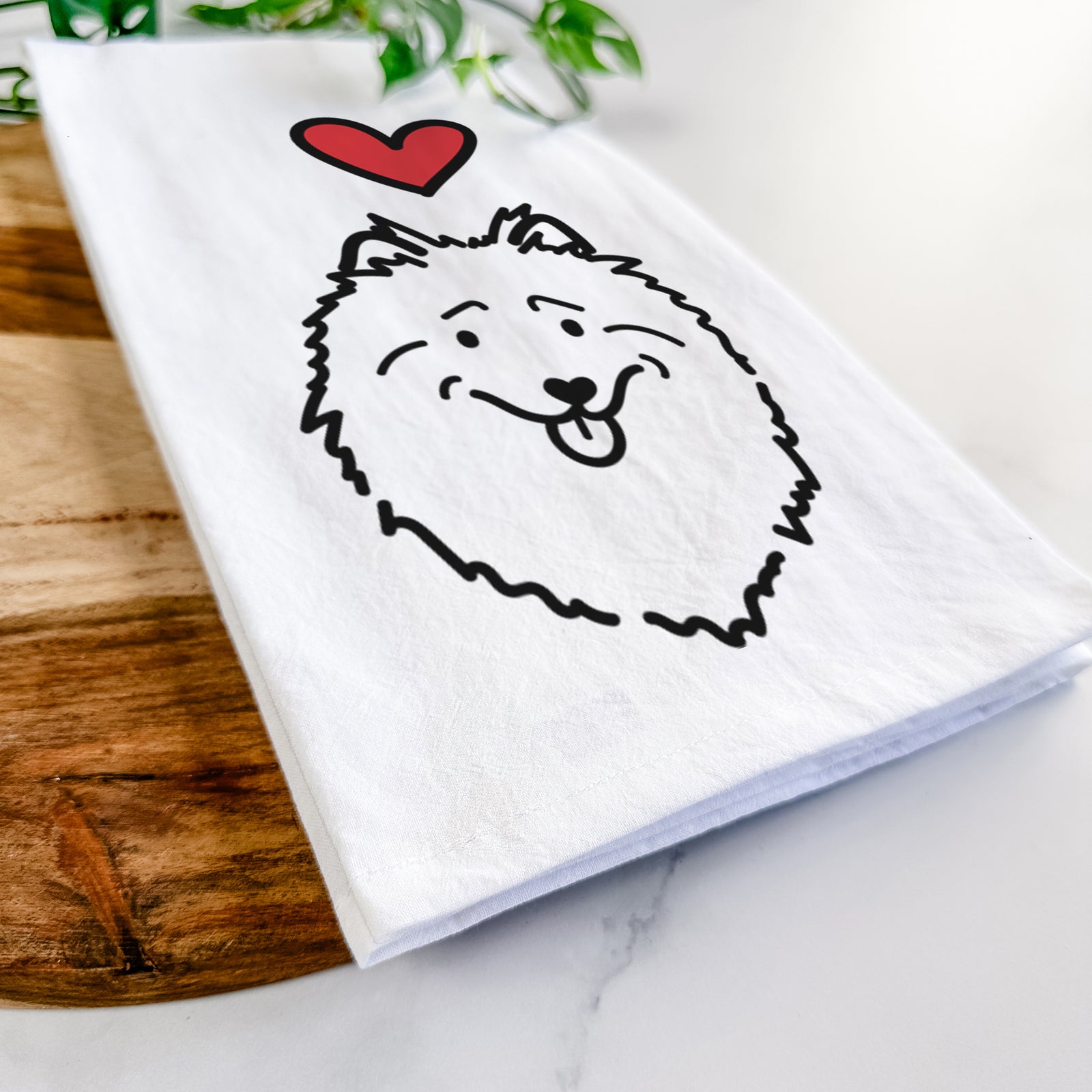 Minimalist line drawing of a Keeshond with a red heart on a tea towel