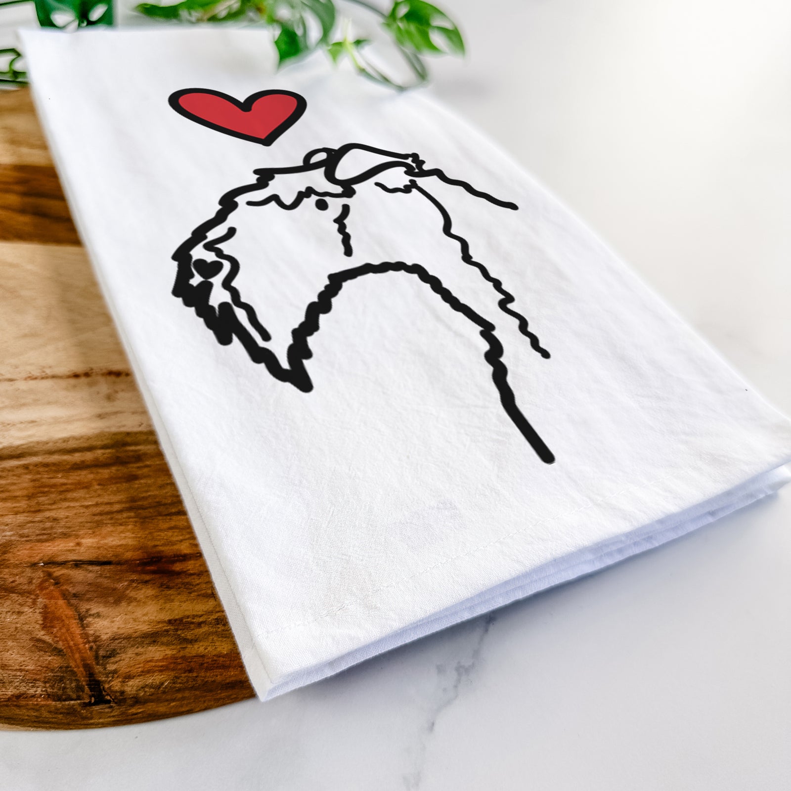 Minimalist line drawing of a Kerry Blue Terrier with a red heart on a tea towel