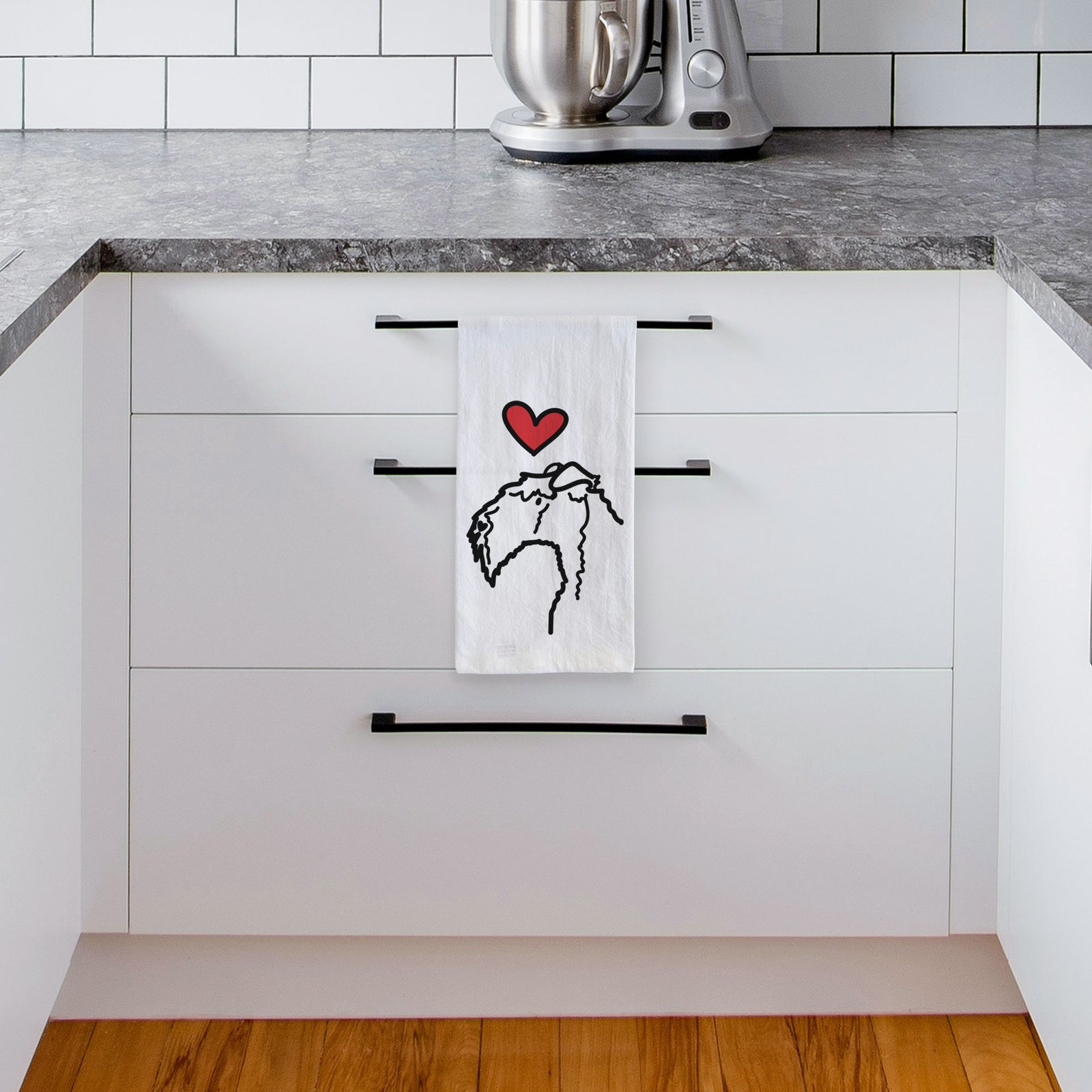 Minimalist line drawing of a Kerry Blue Terrier with a red heart on a tea towel, hanging on an oven door in a kitchen