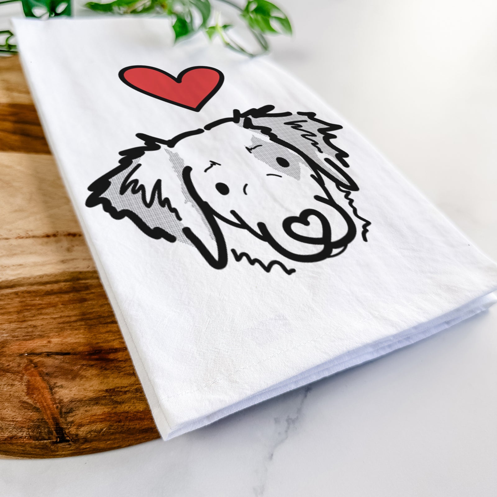 Minimalist line drawing of Kiva the Brittany Spaniel with a red heart on a tea towel