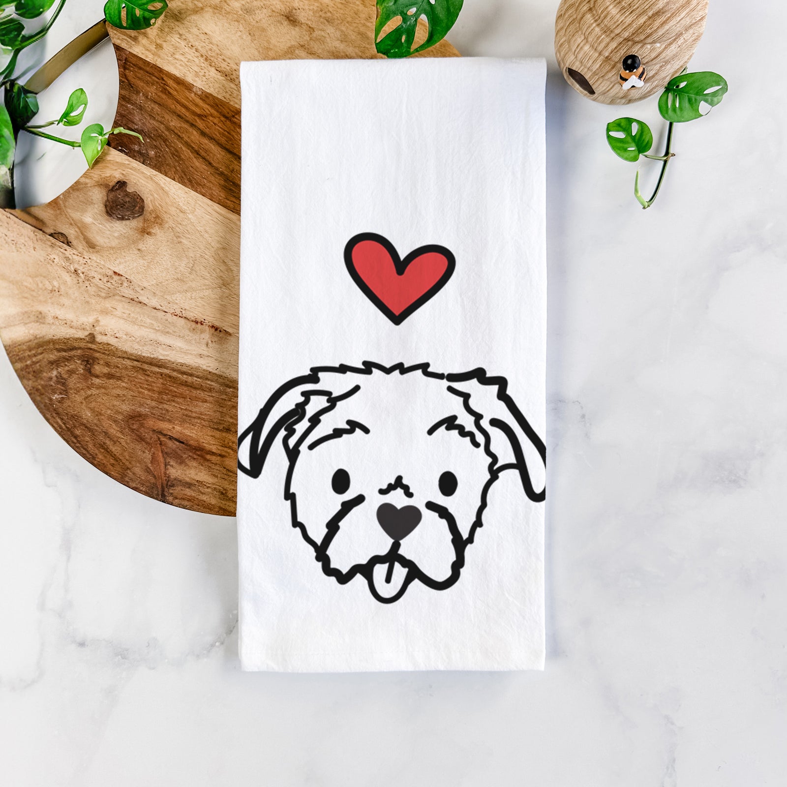 Minimalist line drawing of Koko the Shih Tzu with a red heart on a tea towel